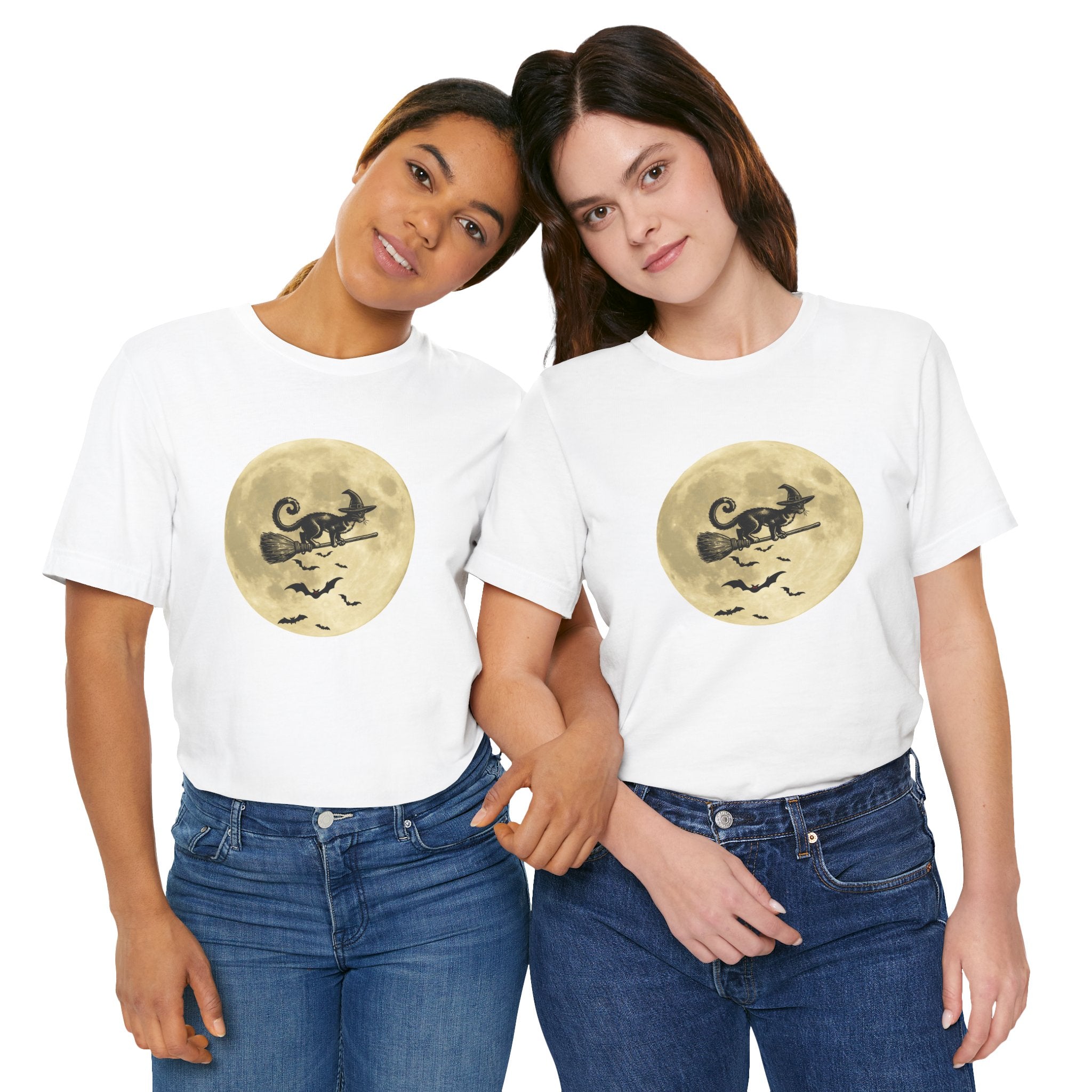 Two people wearing white t-shirts with a moon and broomstick graphic on a white background