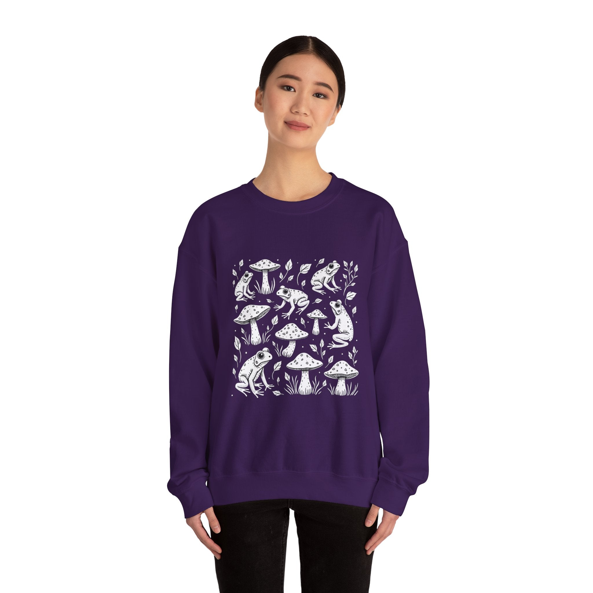 Person wearing a purple sweatshirt with white nature-themed design on a white background