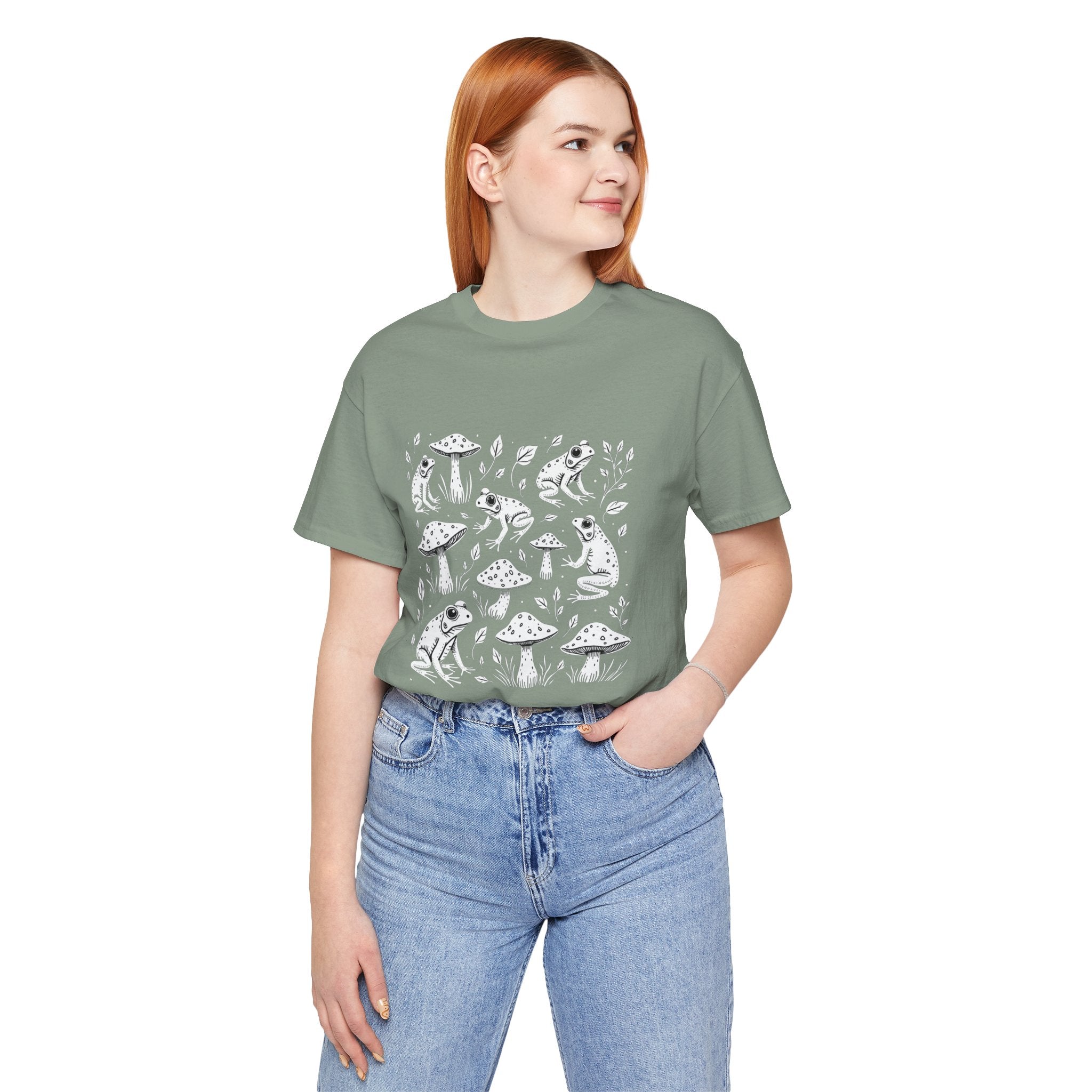 Person wearing a green t-shirt with a graphic design on a white background