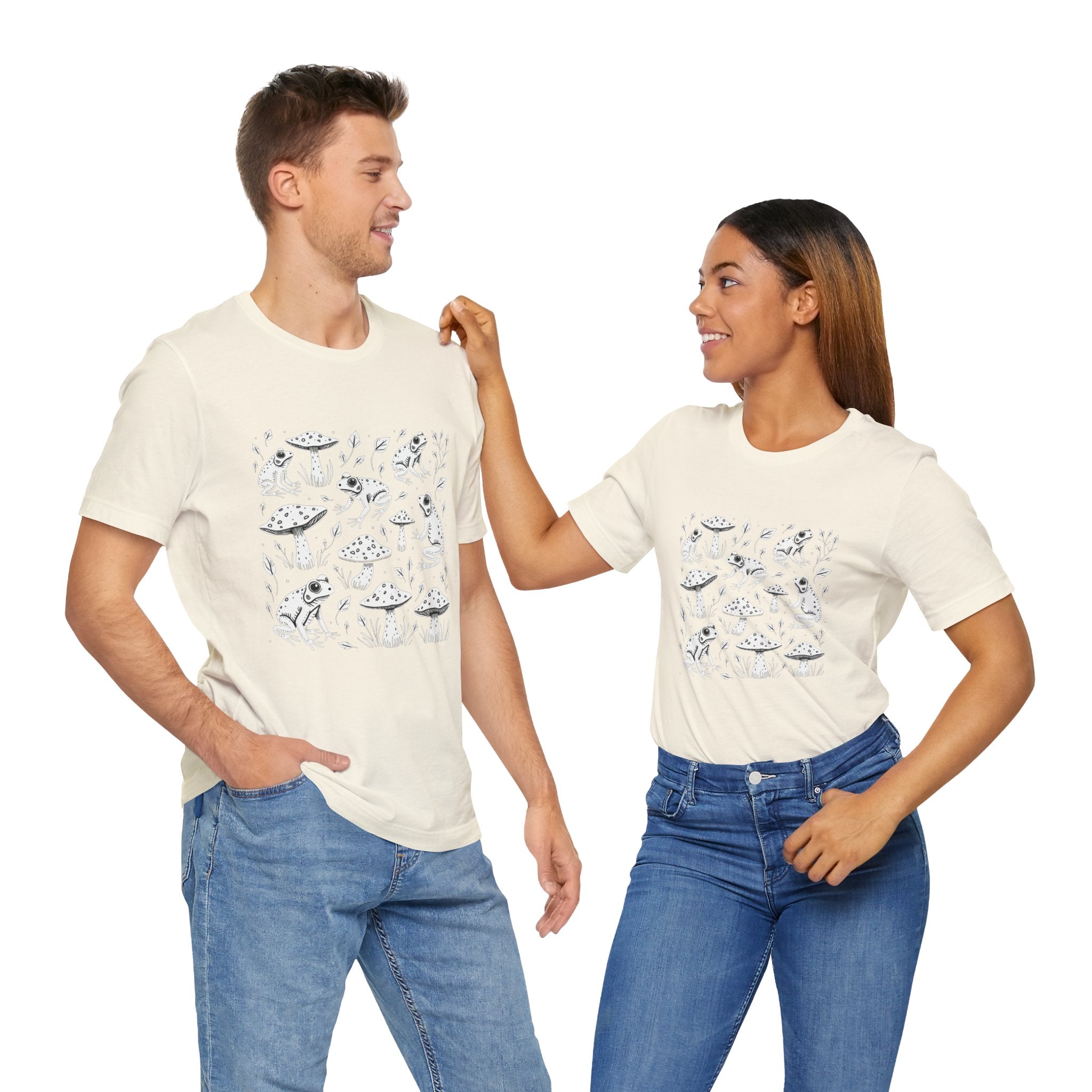 Two people wearing matching t-shirts with a space-themed design on a white background