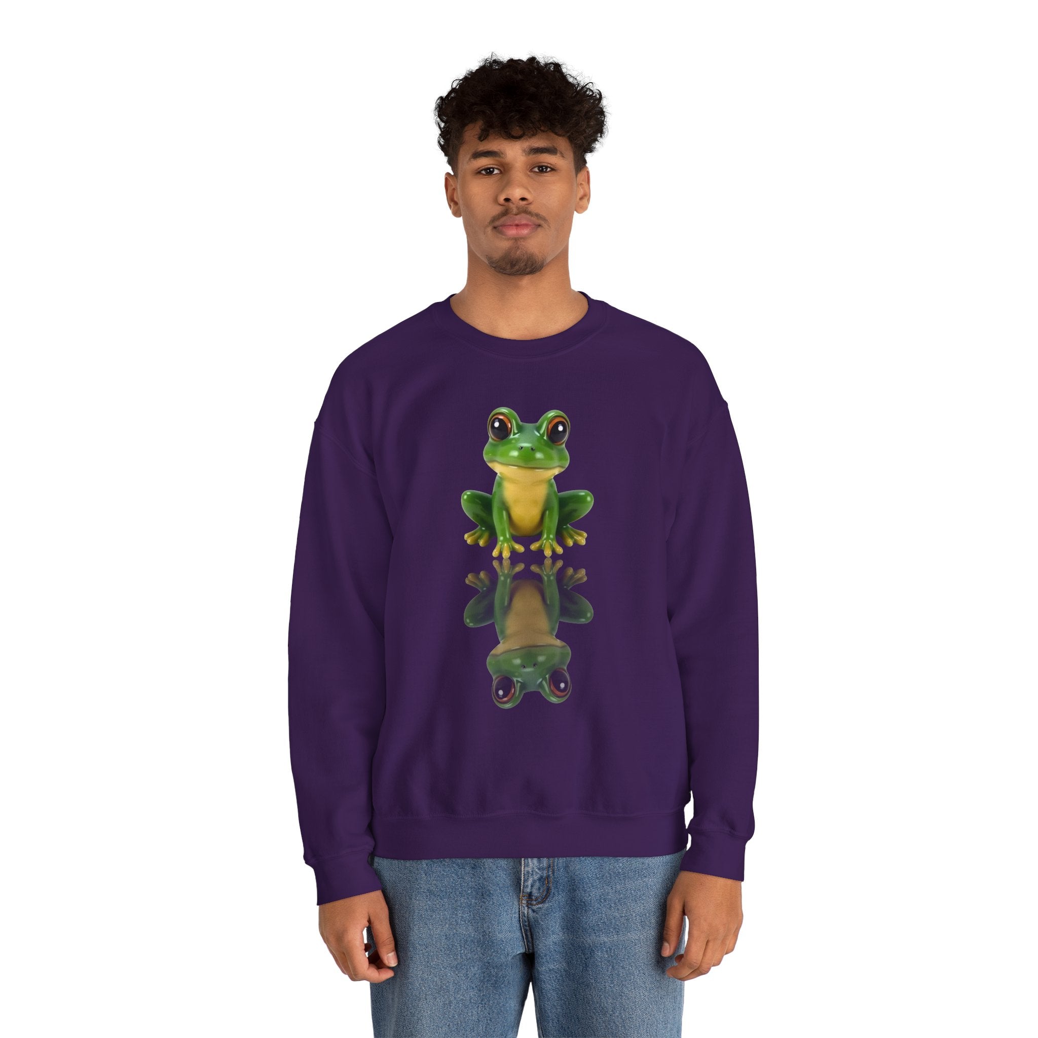 Person wearing a purple sweatshirt with a green frog design on a white background