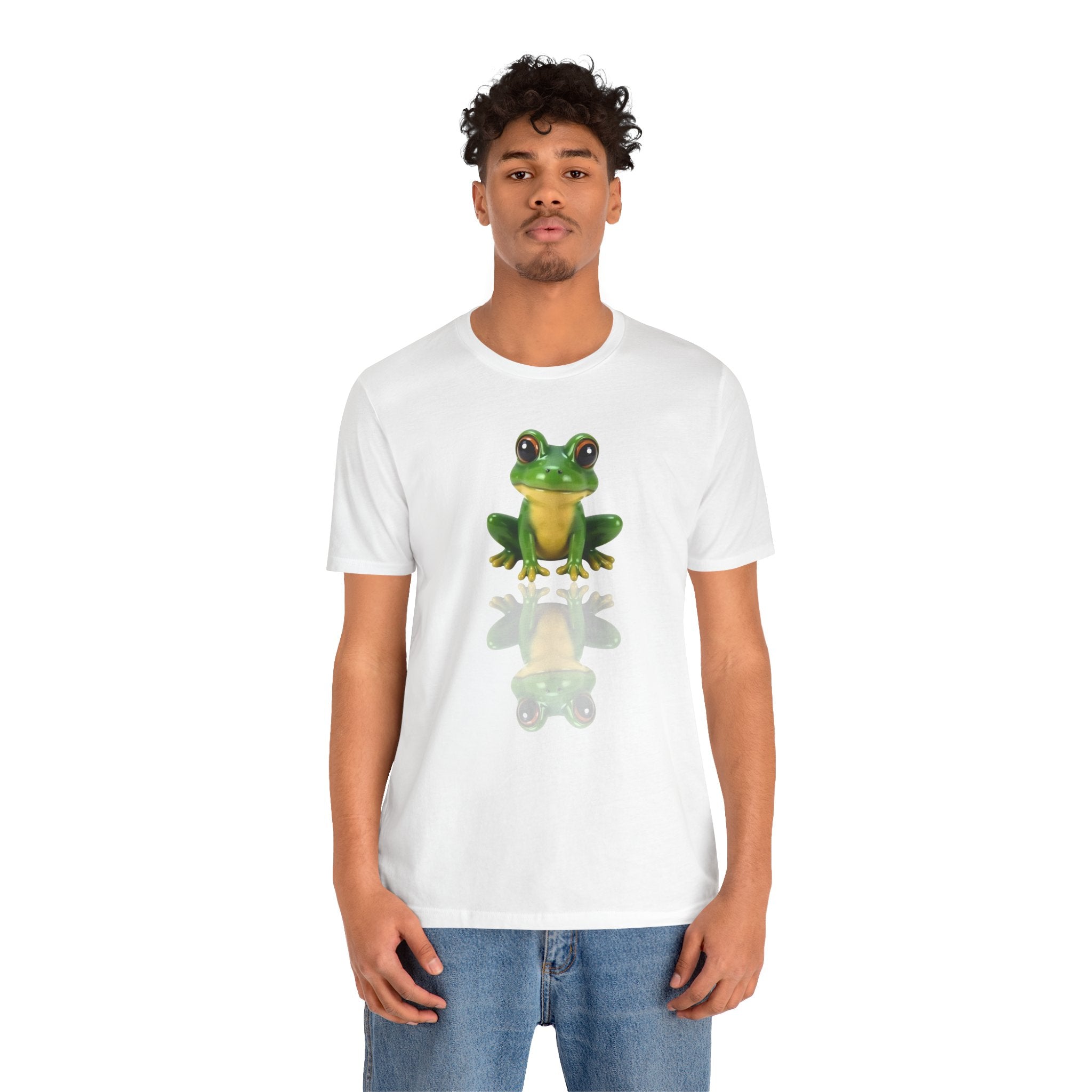 Person wearing a white t-shirt with a frog graphic on a white background
