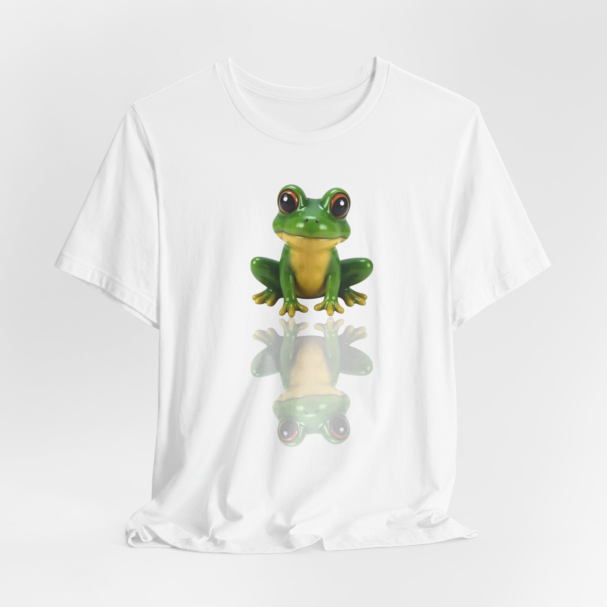 White t-shirt with a green frog graphic on a white background