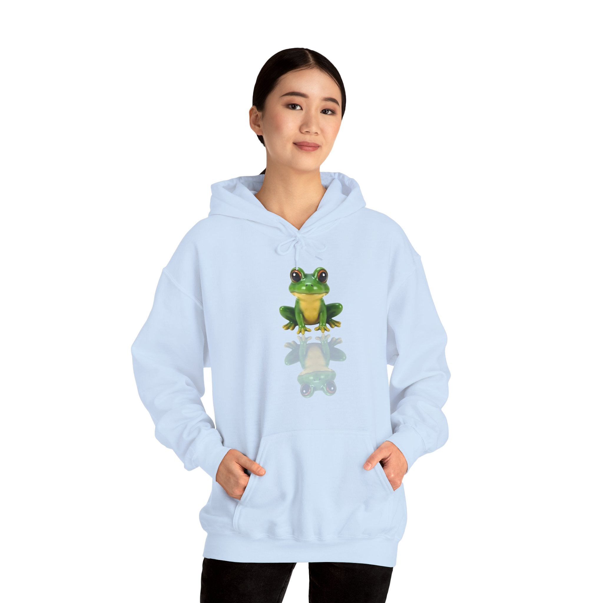 Light blue hoodie with a frog graphic worn by a person on a white background