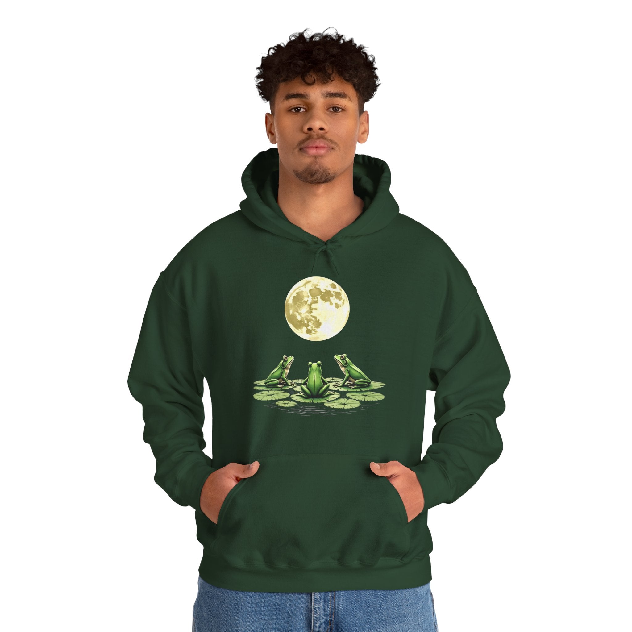 Person wearing a green hoodie with a frog and moon design on a white background