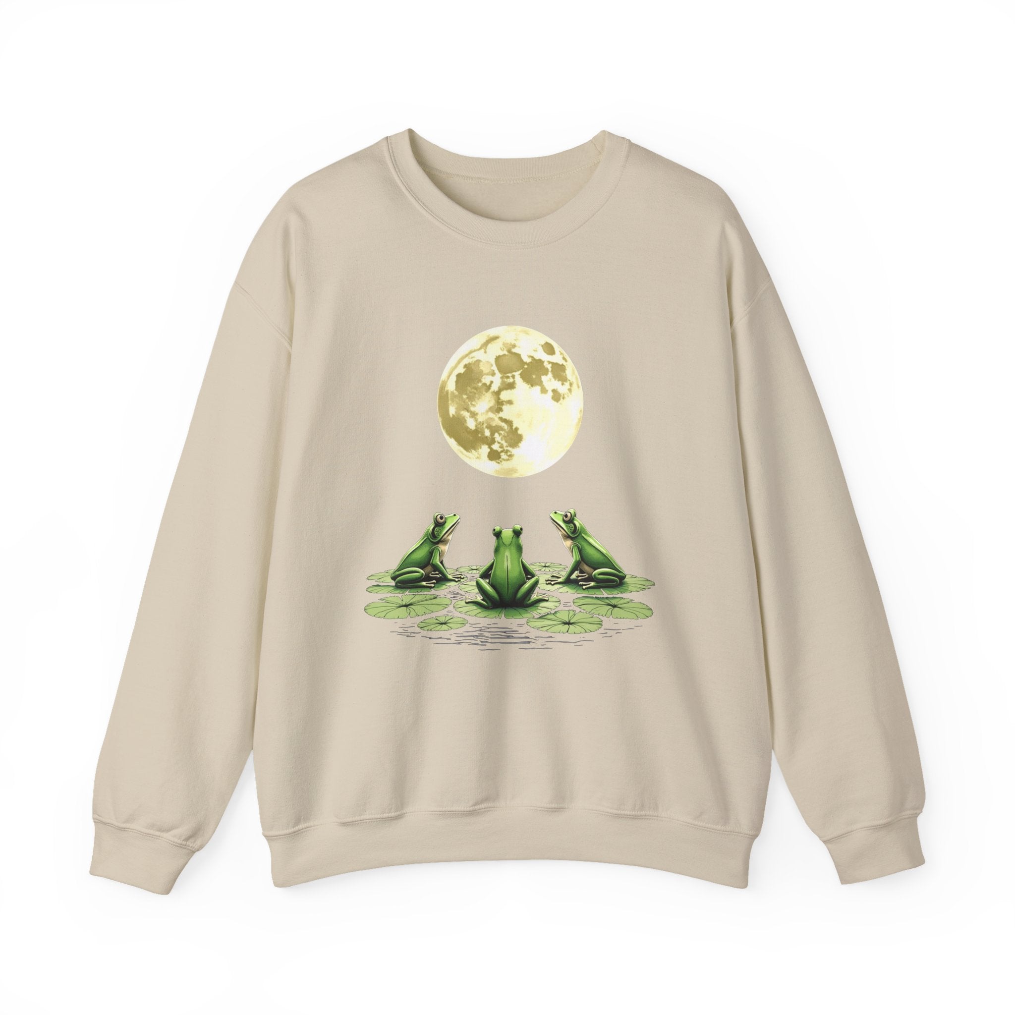 Beige sweatshirt with a graphic of three frogs by a pond and a full moon on a white background