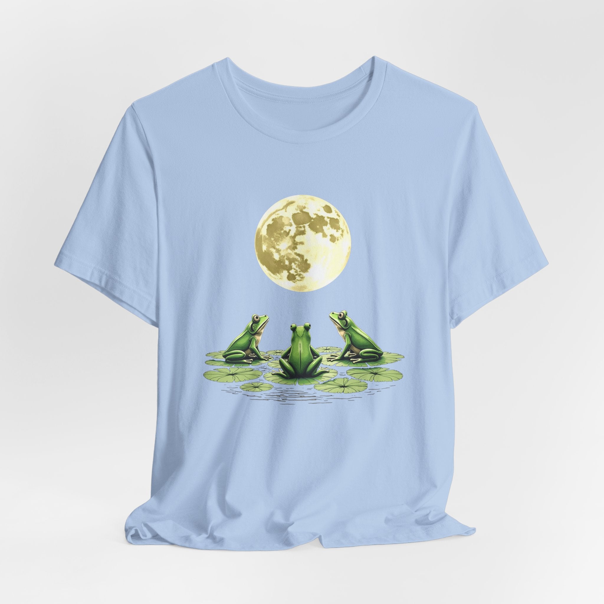 Baby light blue t-shirt featuring cute frogs sitting on top of water lily watching on the moon graphic on a white background
