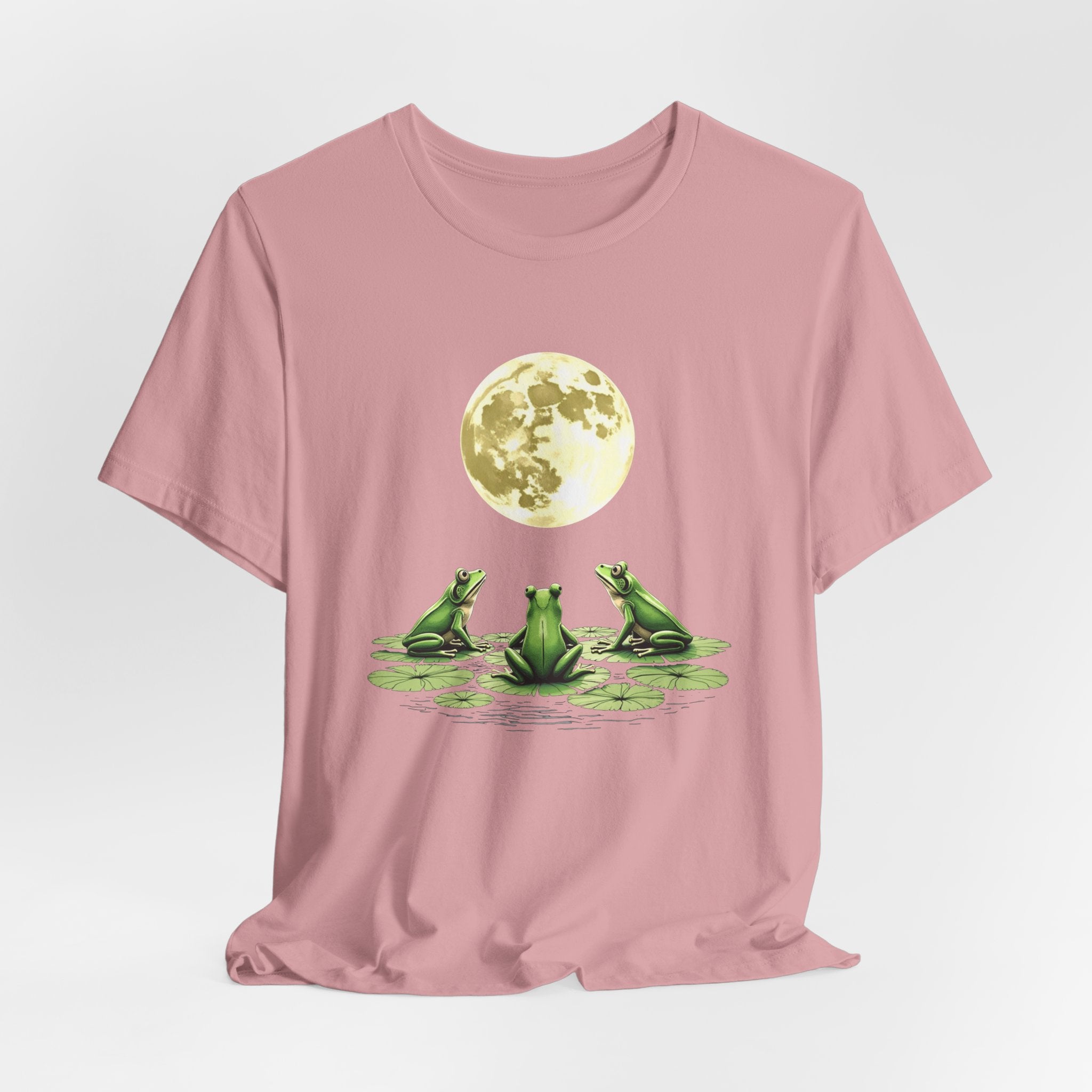 Orchid pink t-shirt featuring cute frogs sitting on top of water lily watching on the moon graphic on a white background