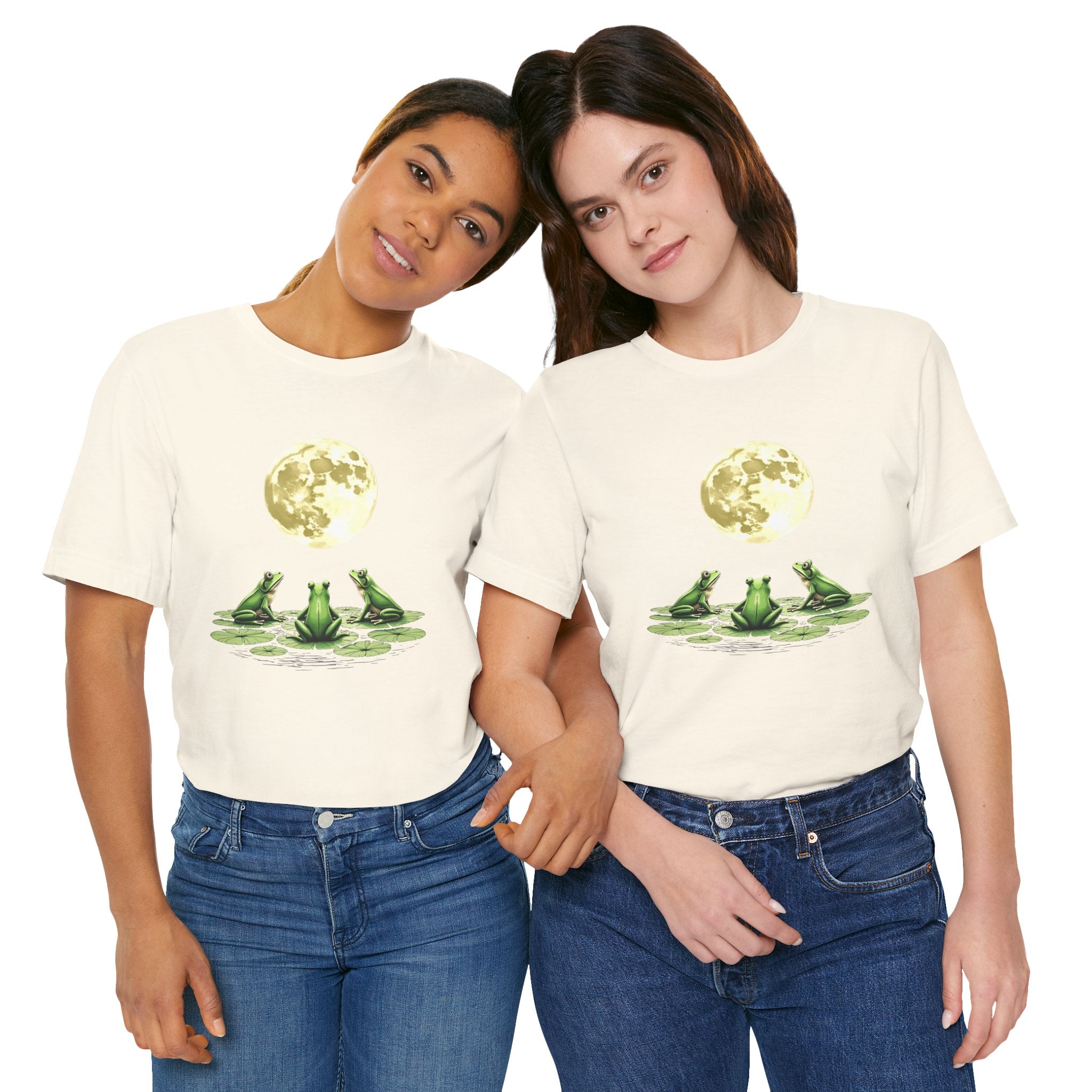 Two people wearing cream t-shirts with a graphic of frogs on a white background