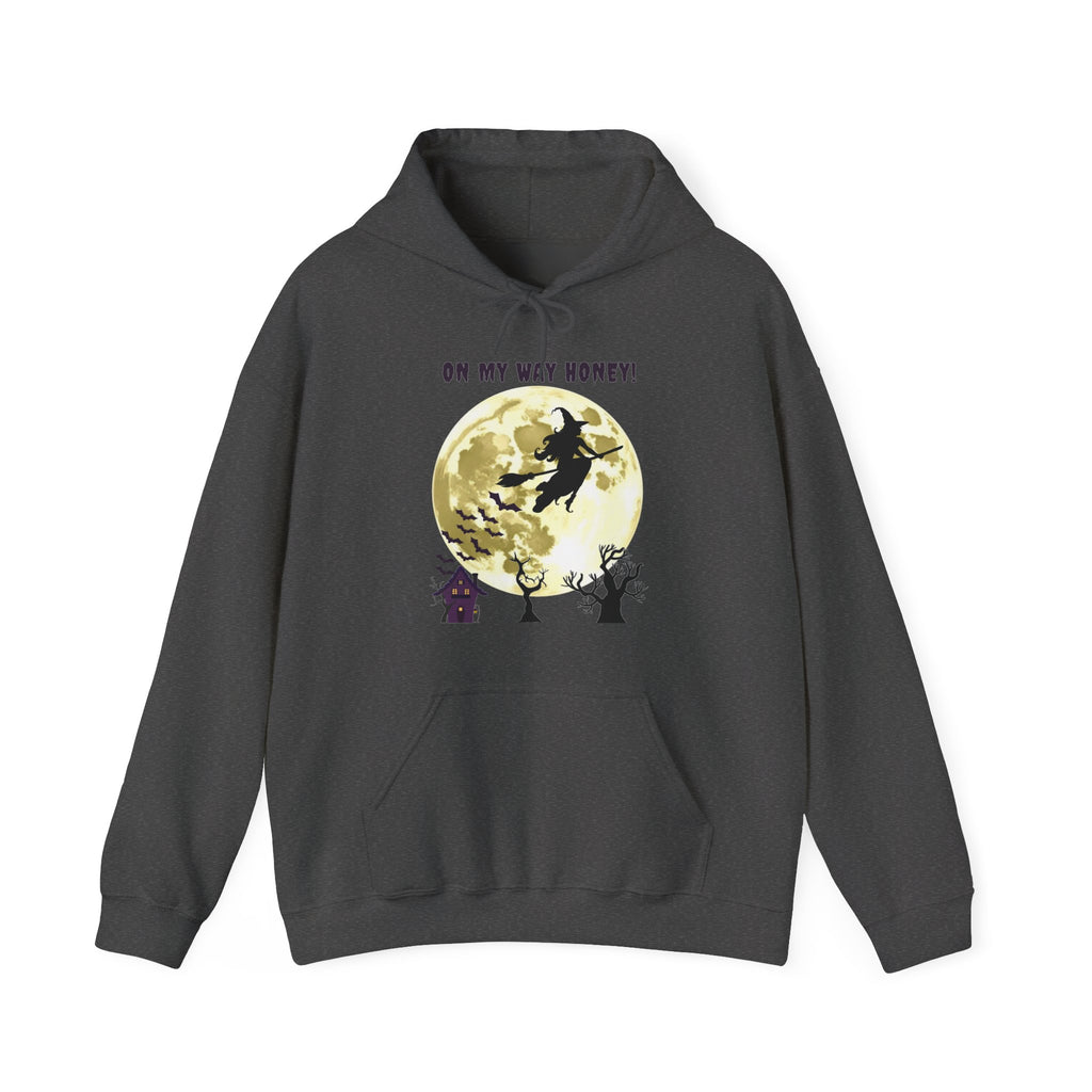 Dark gray hoodie with a witch flying over a moonlit scene on a white background