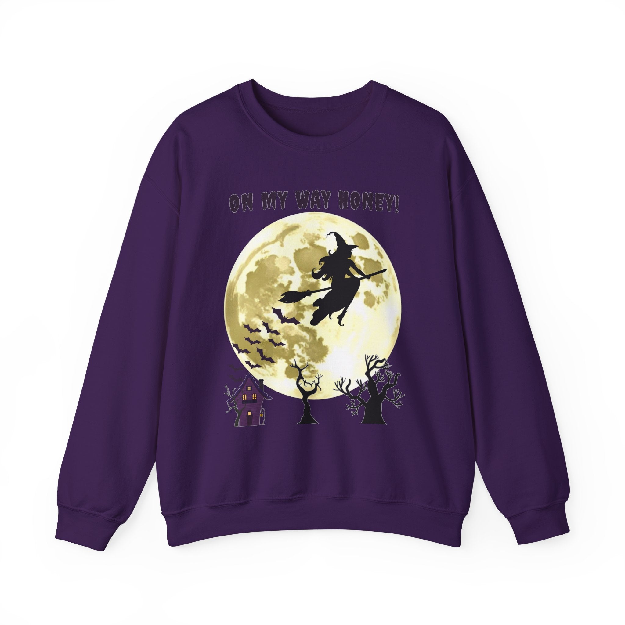 Purple sweatshirt with Halloween design featuring a witch and moon on a white background