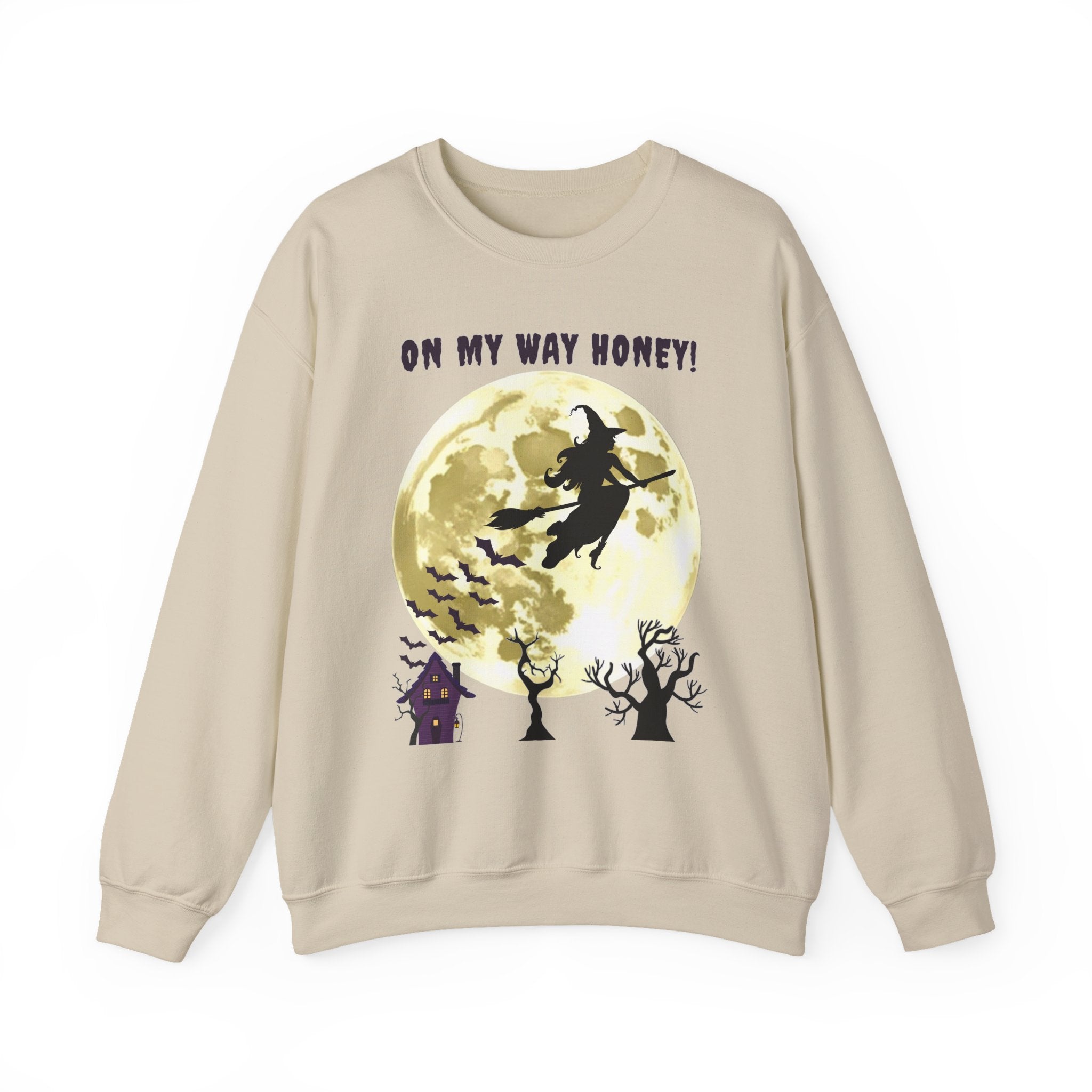 Beige sweatshirt with Halloween design featuring a witch and moon, text 'On My Way Honey!'.
