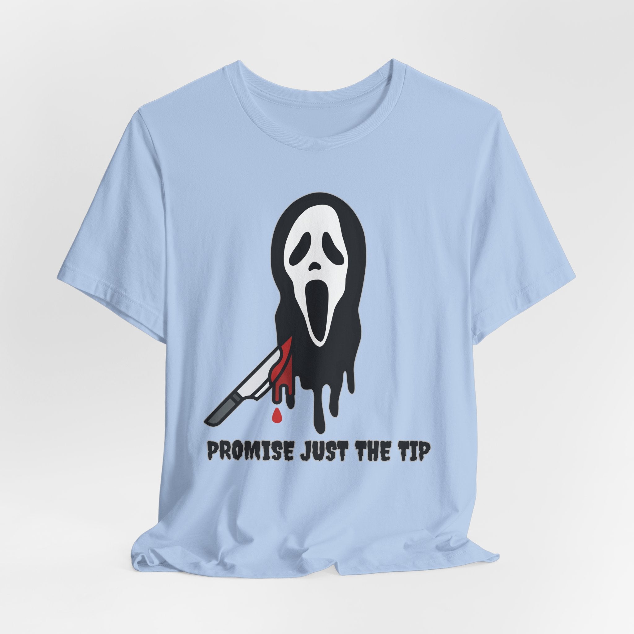Light blue t-shirt with a graphic design of a face with a knife and text on a white background