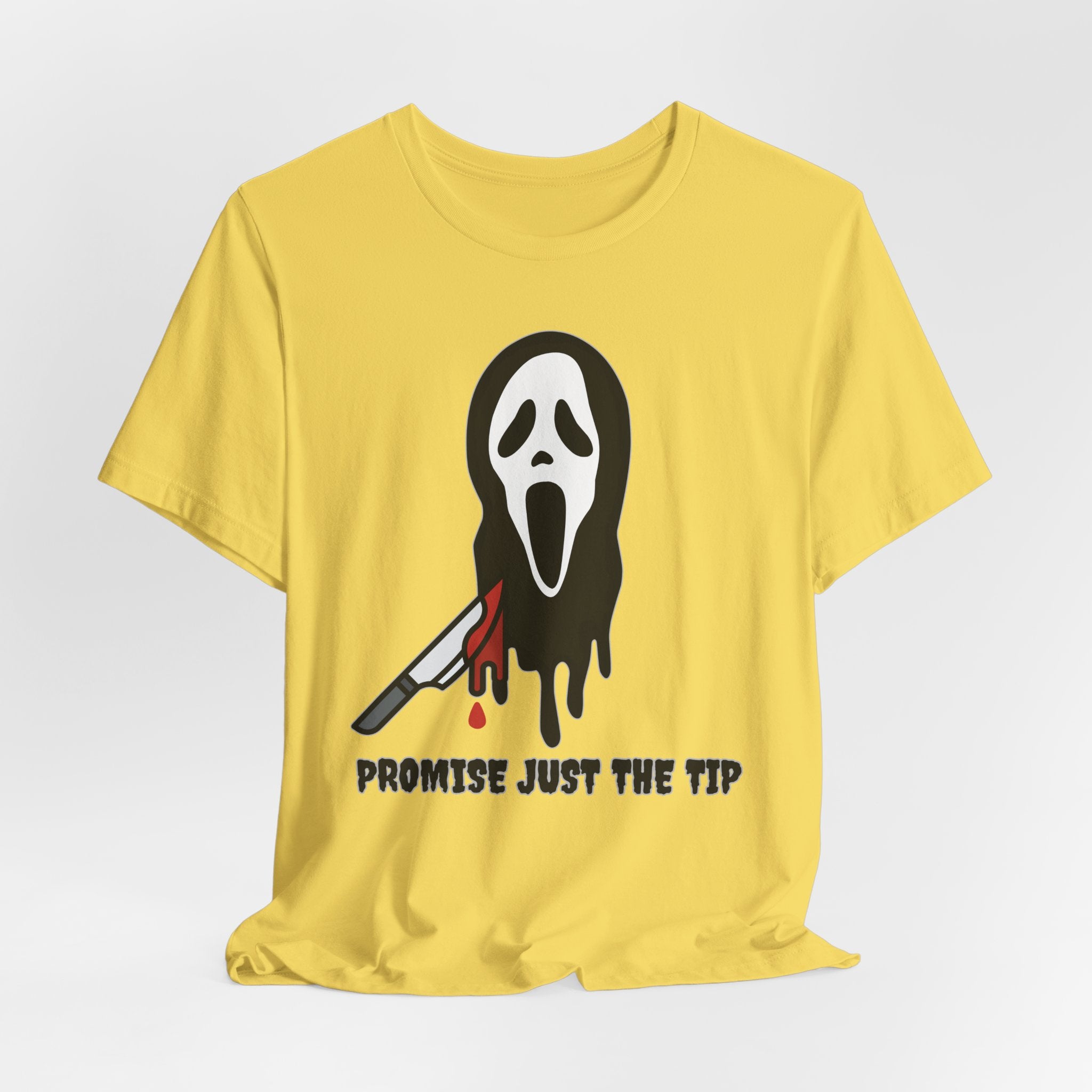 Maze yellow t-shirt with a graphic design of a face with a knife and text 'Promise Just the Tip' on a white background.