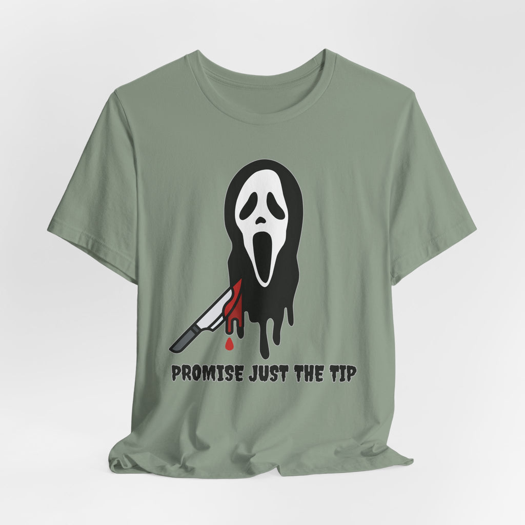Sage green t-shirt with a graphic design of a face with a knife and text 'Promise Just the Tip' on a white background