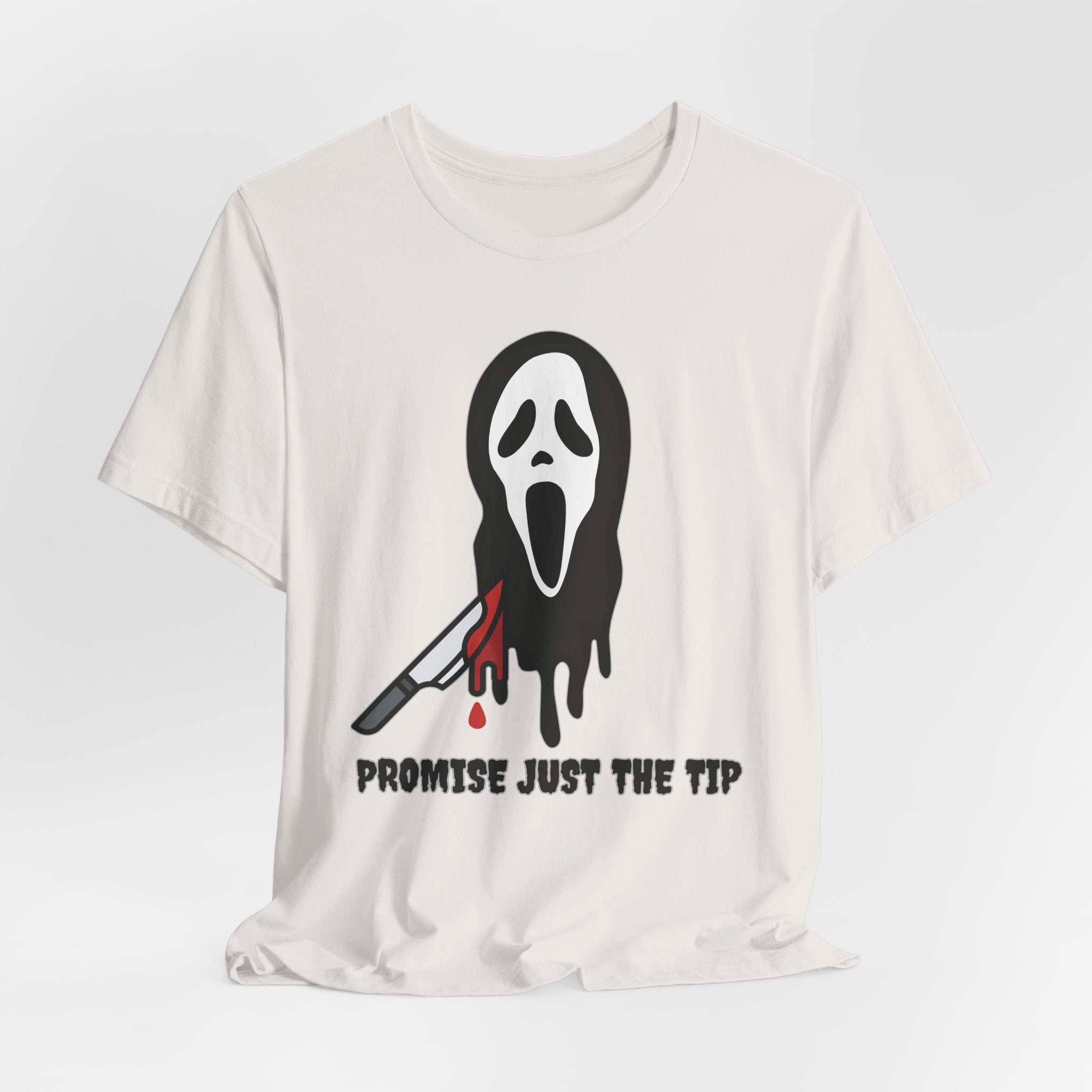 Vintage white t-shirt with a graphic design of a face with a knife and text 'Promise Just The Tip' on a white background