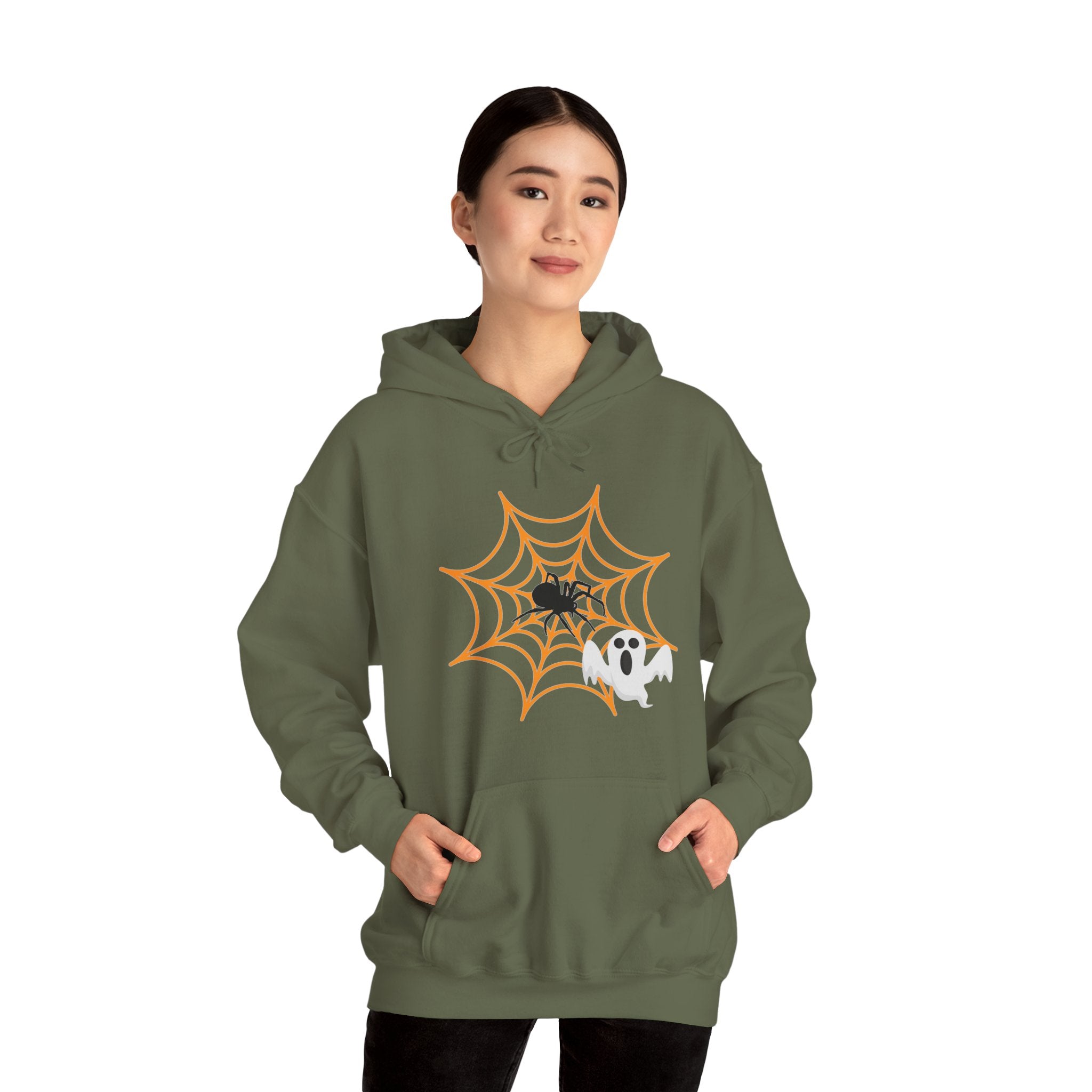 Person wearing a green hoodie with a Halloween design on a white background