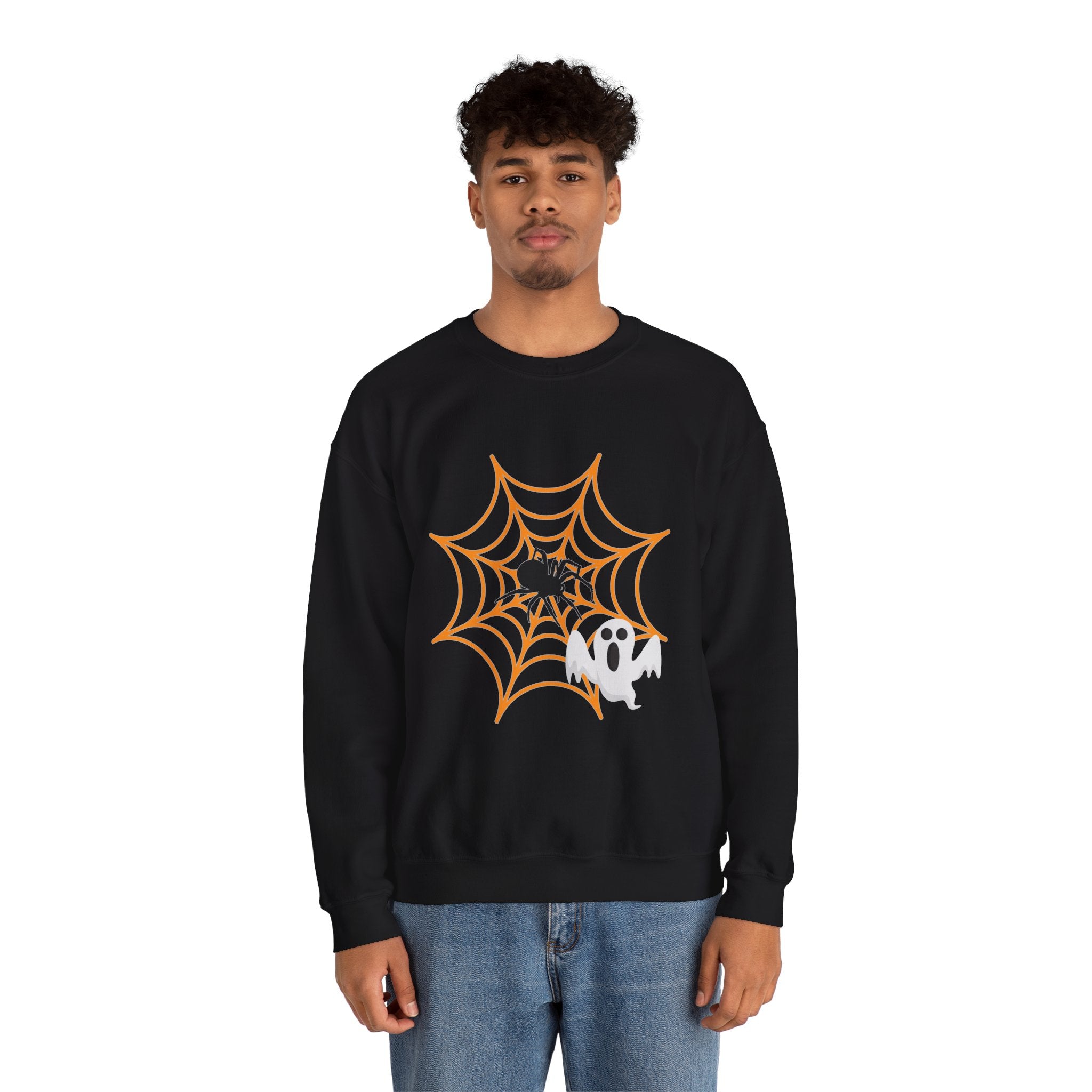 Person wearing a black sweatshirt with a Halloween design on a white background