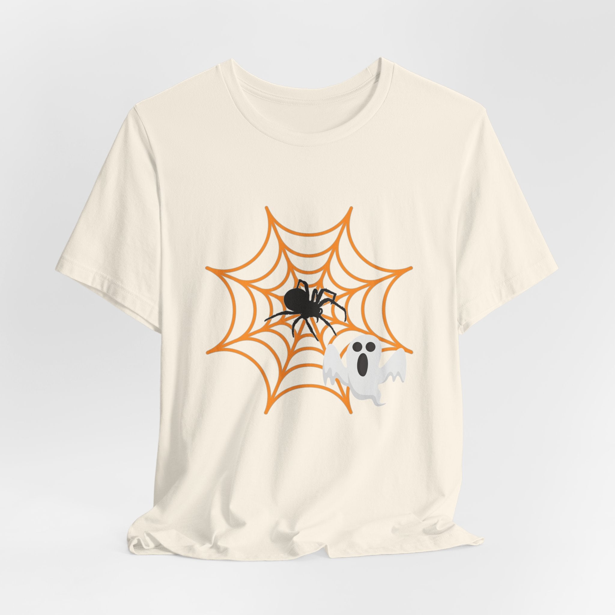 Natural beige t-shirt with Halloween design of a spider, web, and ghost on a light gray background