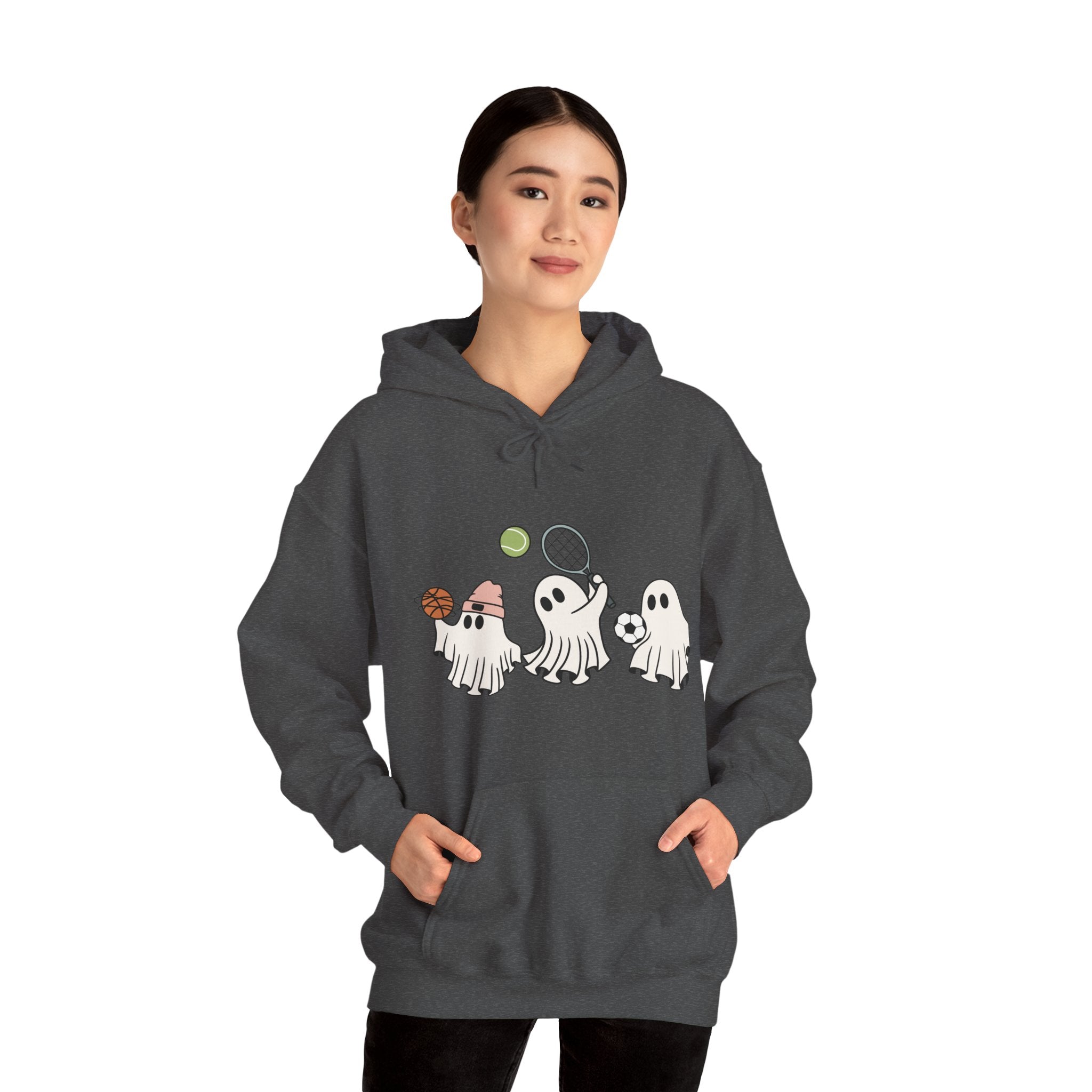 Person wearing a dark gray hoodie with ghost designs on a white background