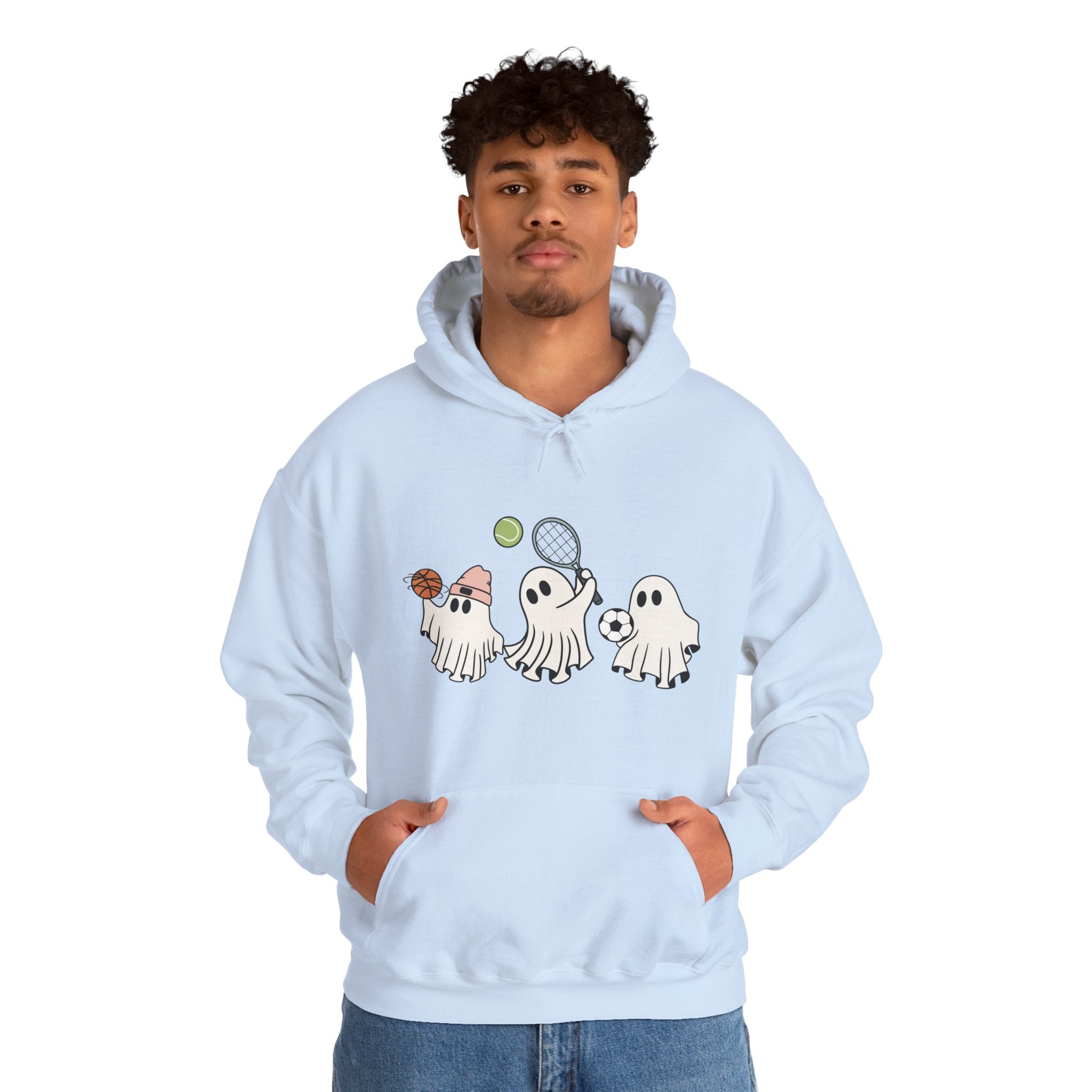 Person wearing a light blue hoodie with cartoon ghost designs on a white background