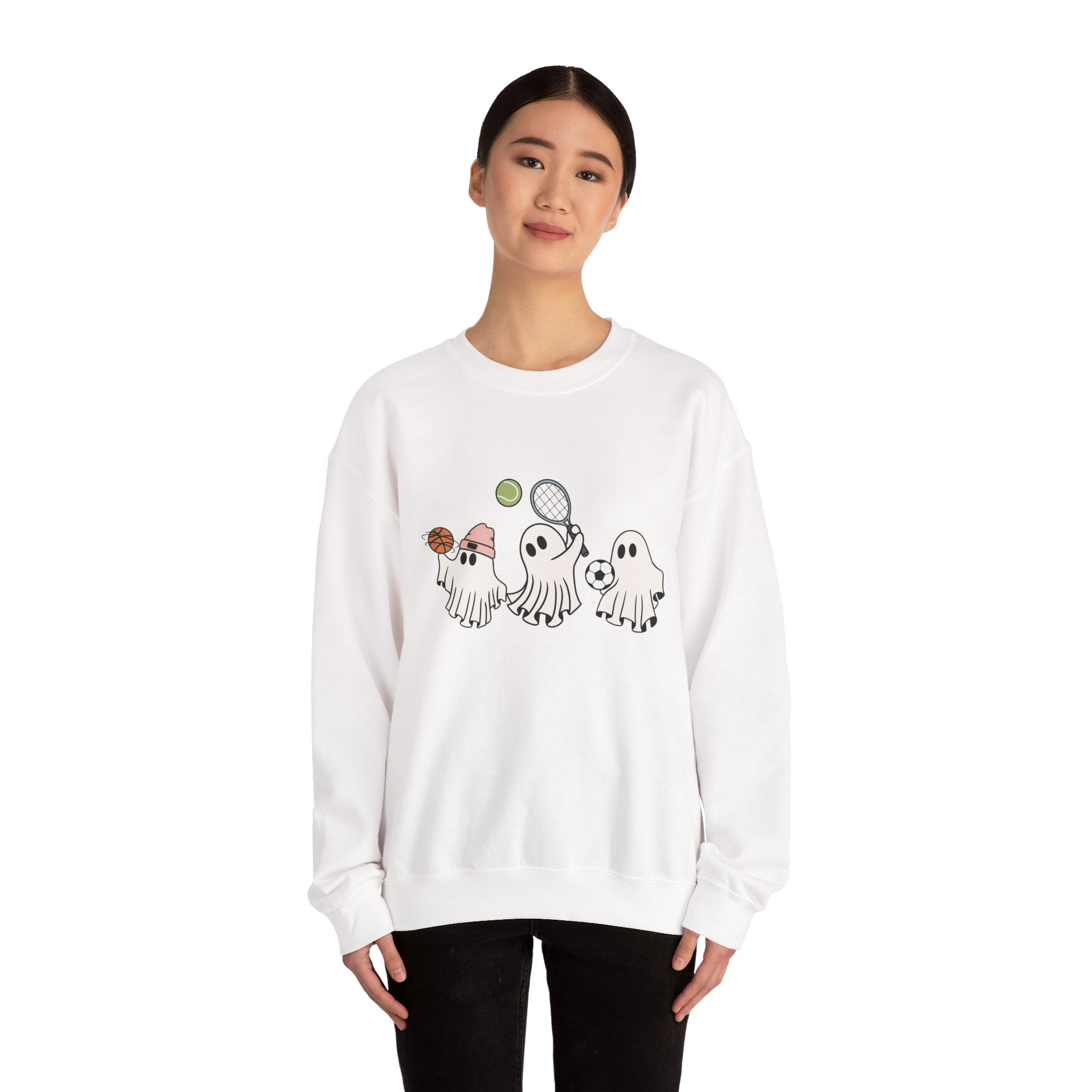 Person wearing a white sweatshirt with cartoon designs on a white background