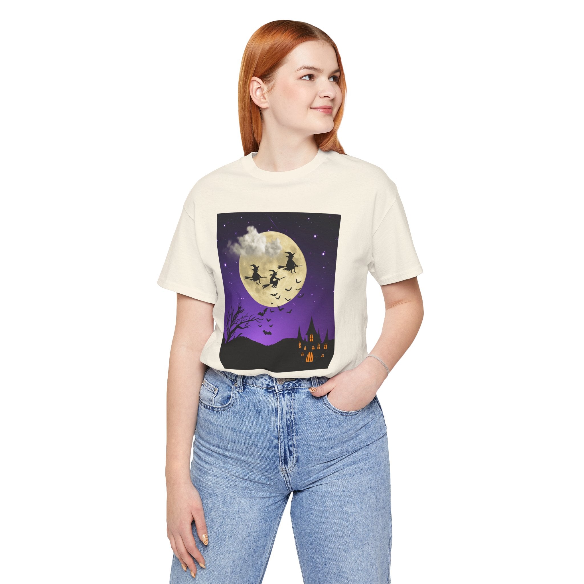 Person wearing a t-shirt with a Halloween-themed graphic design on a white background