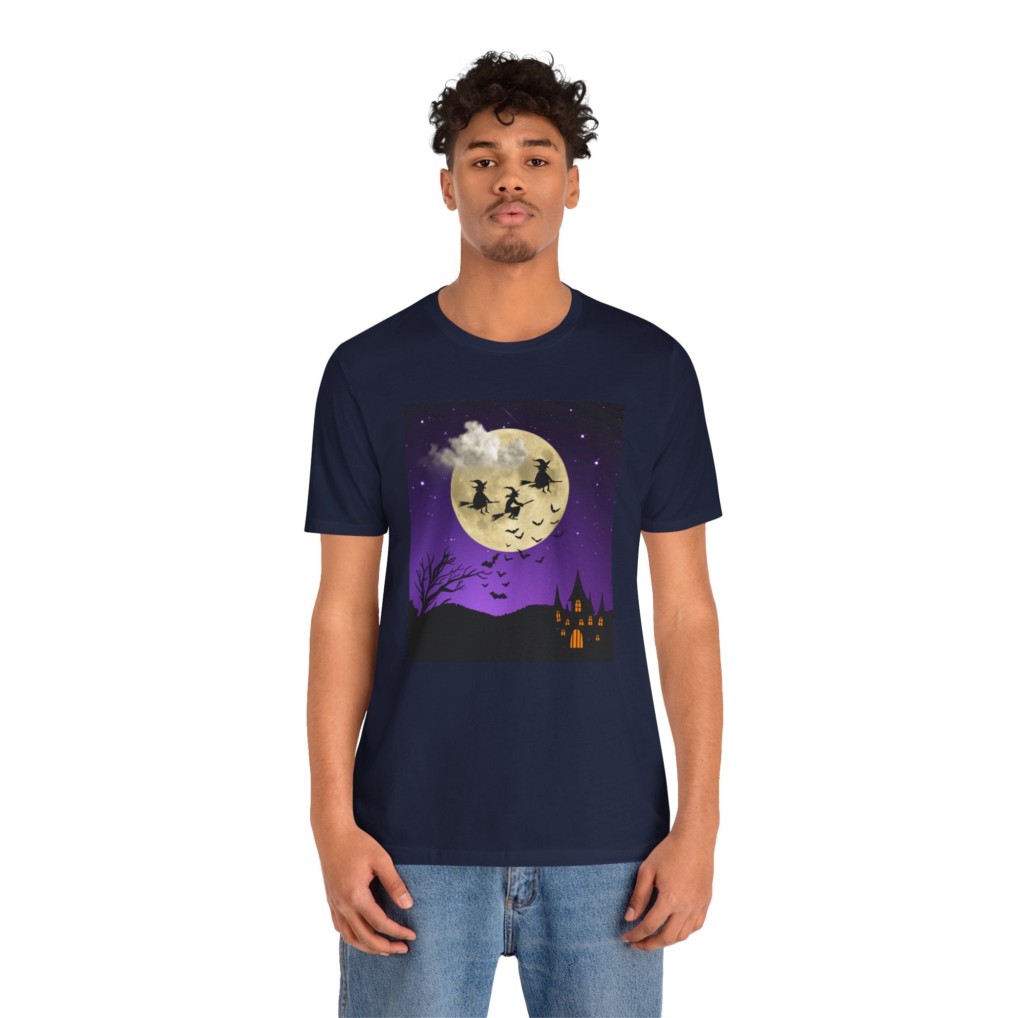 Person wearing a navy blue t-shirt with a Halloween-themed design on a white background