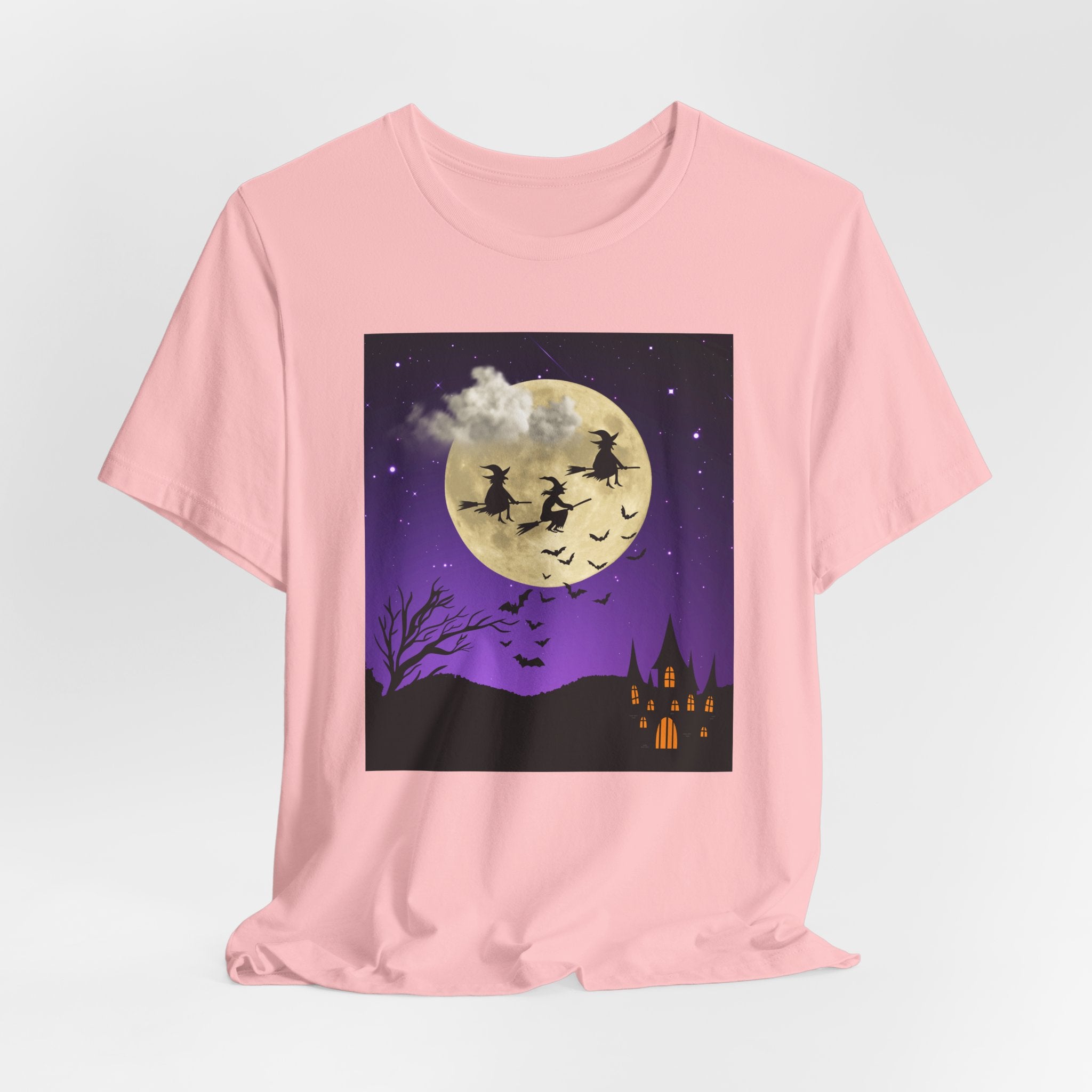 Pink t-shirt with Halloween-themed graphic on a light gray background