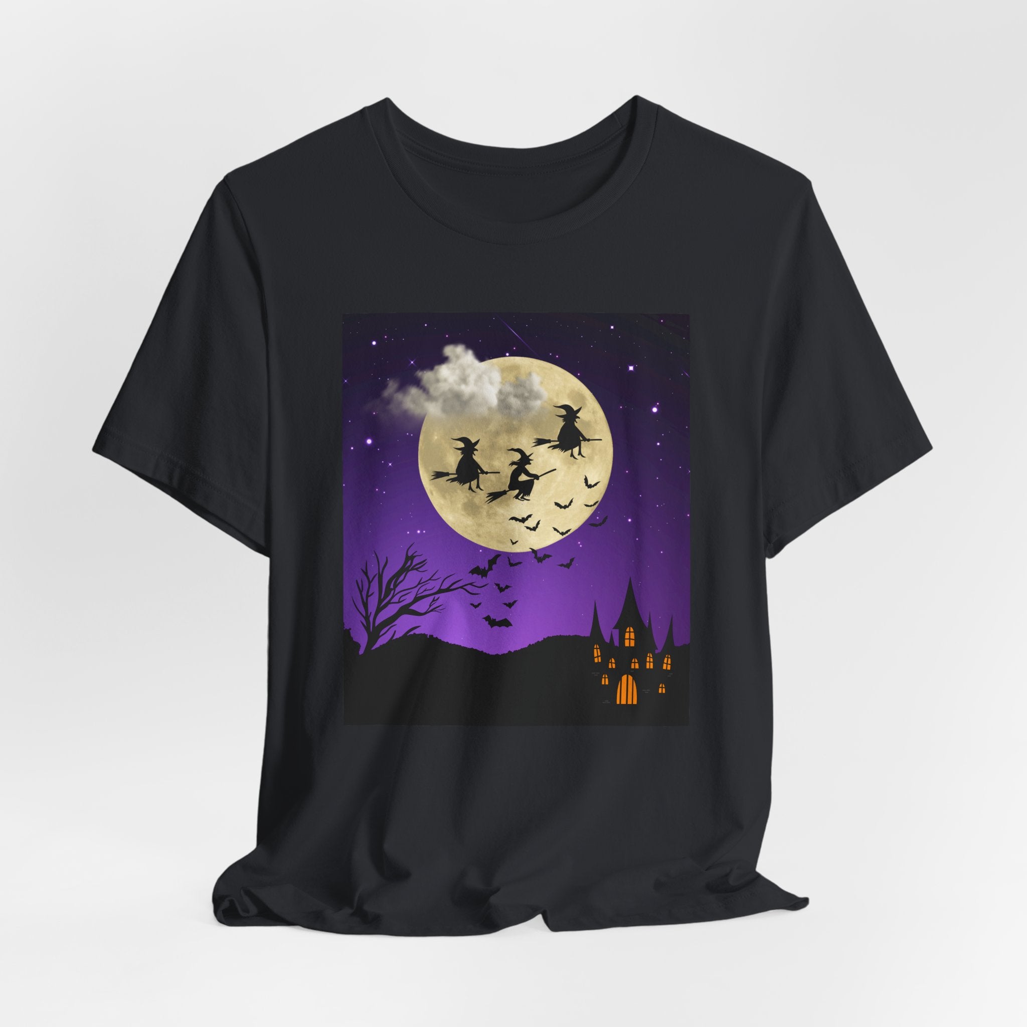 Vintage black t-shirt with Halloween-themed design featuring witches on brooms and a full moon.