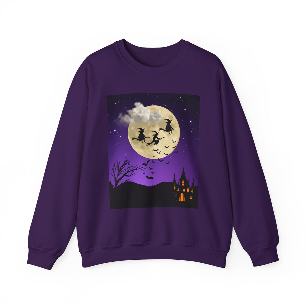 Purple sweatshirt with Halloween-themed design featuring a moon, witches, and a castle on a white background.