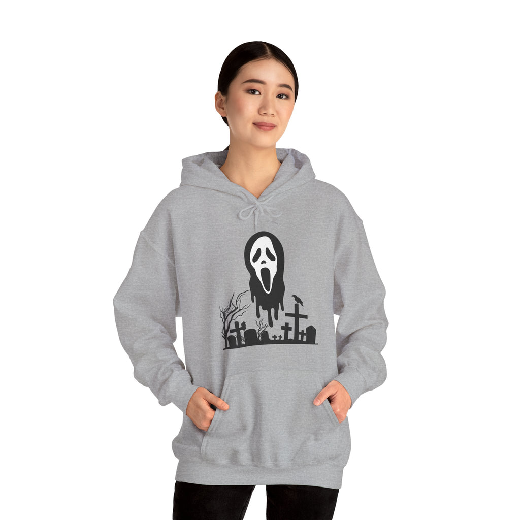 Person wearing a gray hoodie with a graphic design on a white background