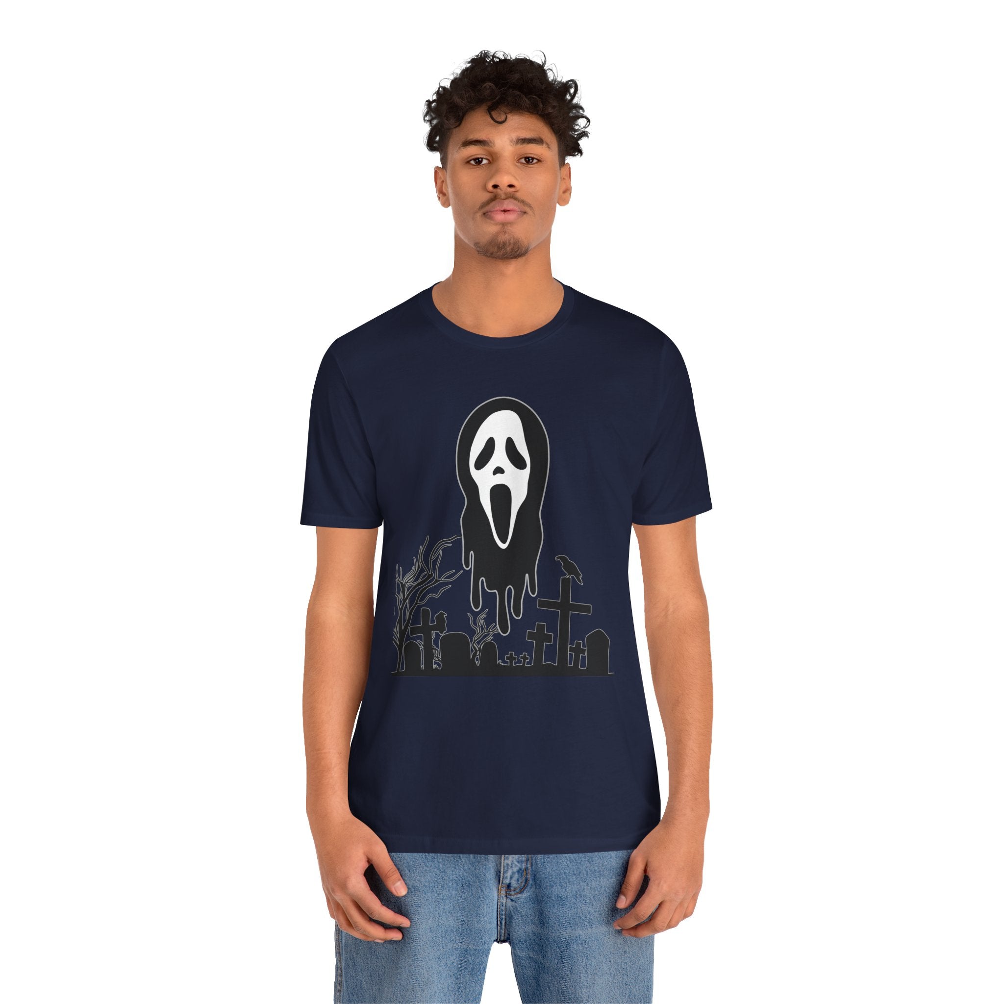 Person wearing a navy blue t-shirt with a graphic design on a white background