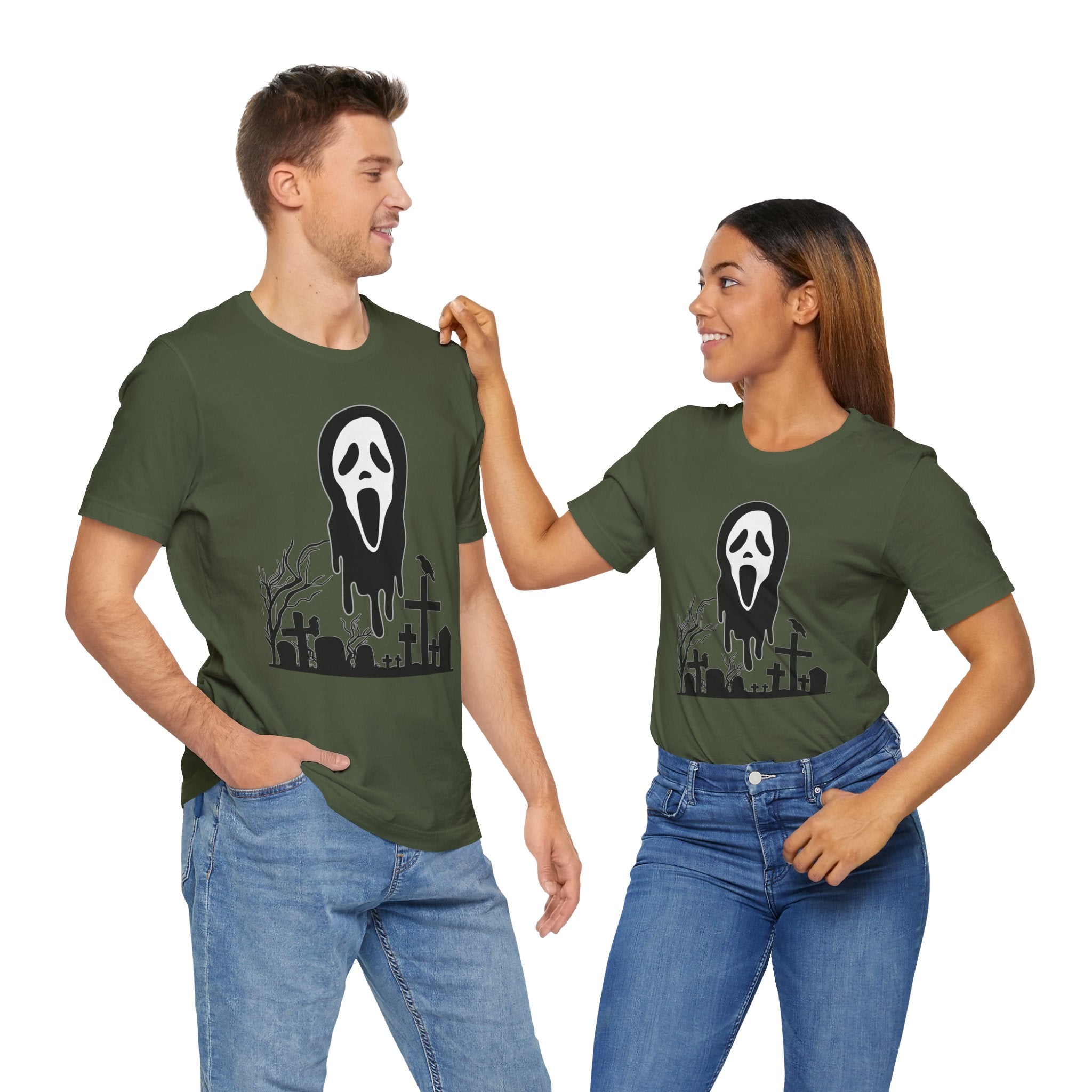 Two people wearing green t-shirts with a graphic design on a white background