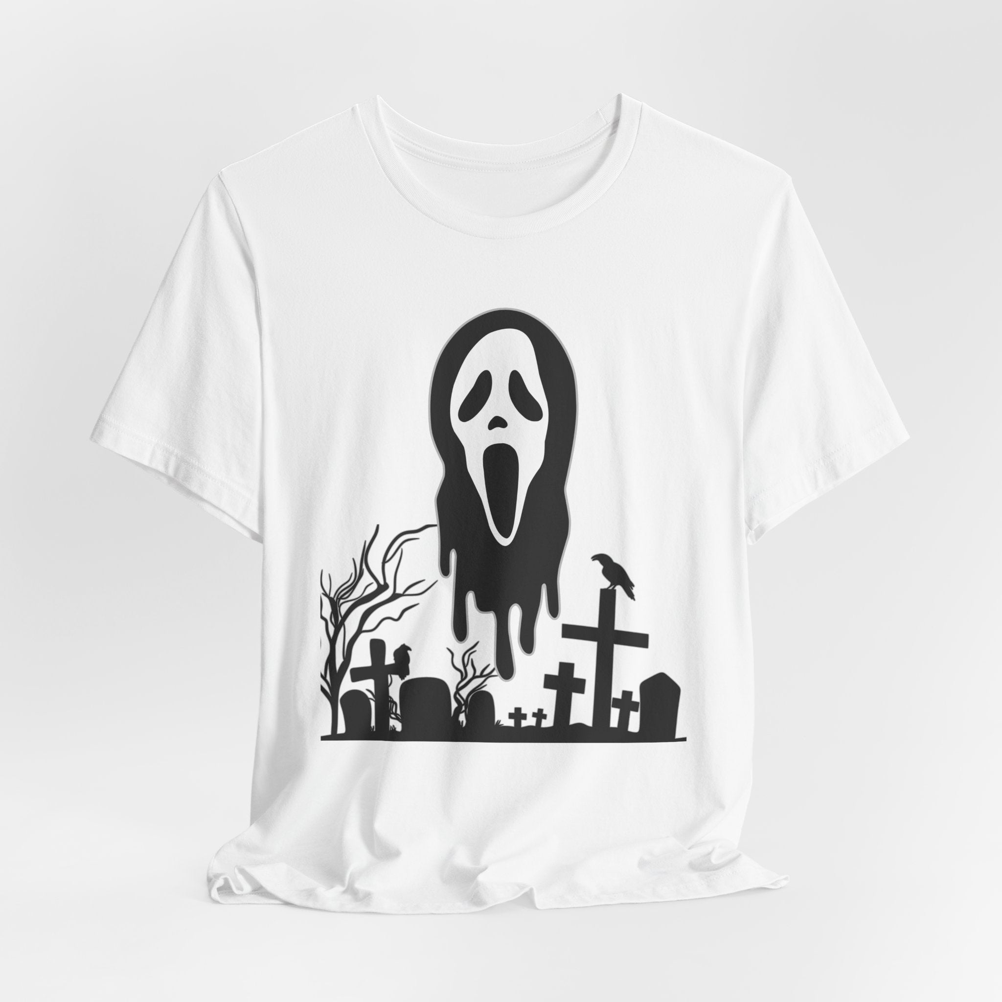 White t-shirt with a black graphic of a ghost face and graveyard on a white background