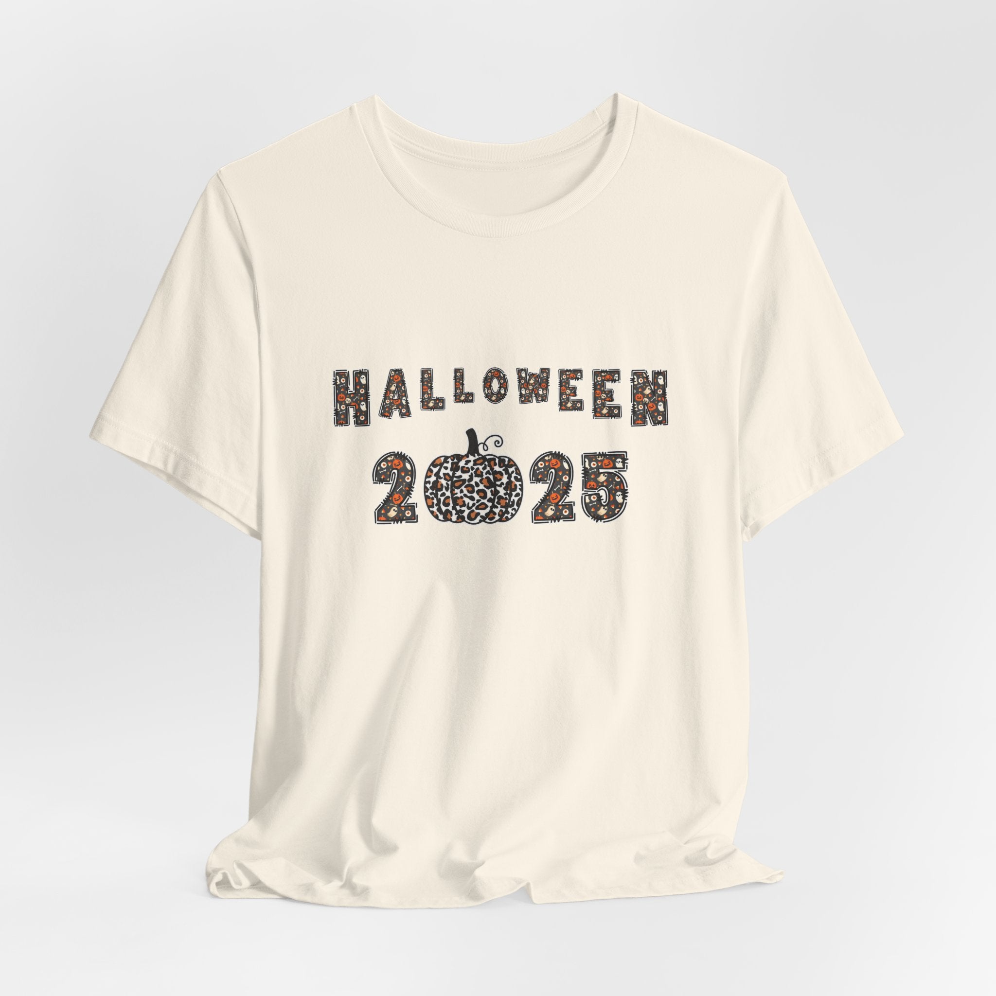 Ivory beige t-shirt with 'Halloween 2025' design and spooky themes on a white background