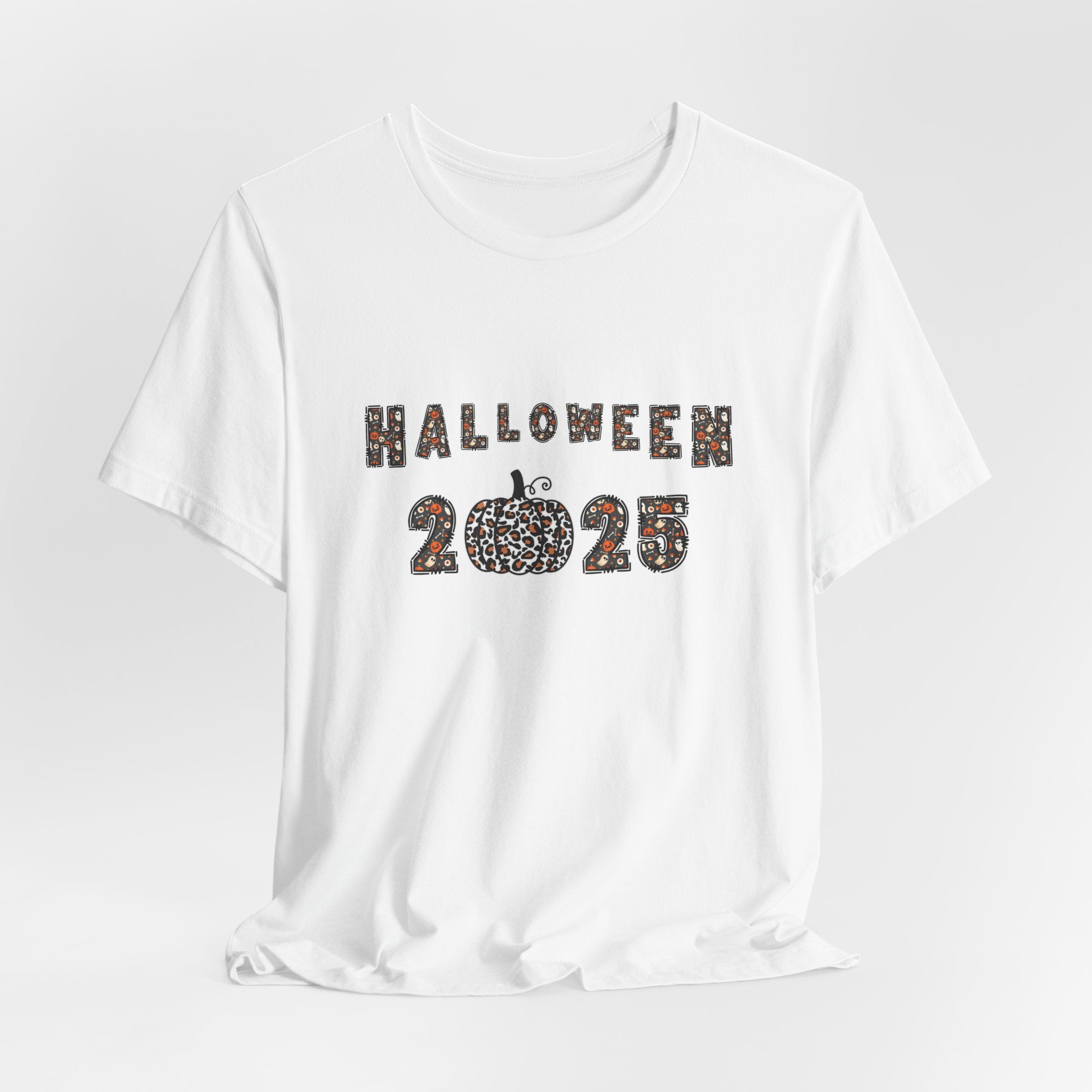 White t-shirt with 'Halloween 2025' design and spooky themes on a white background