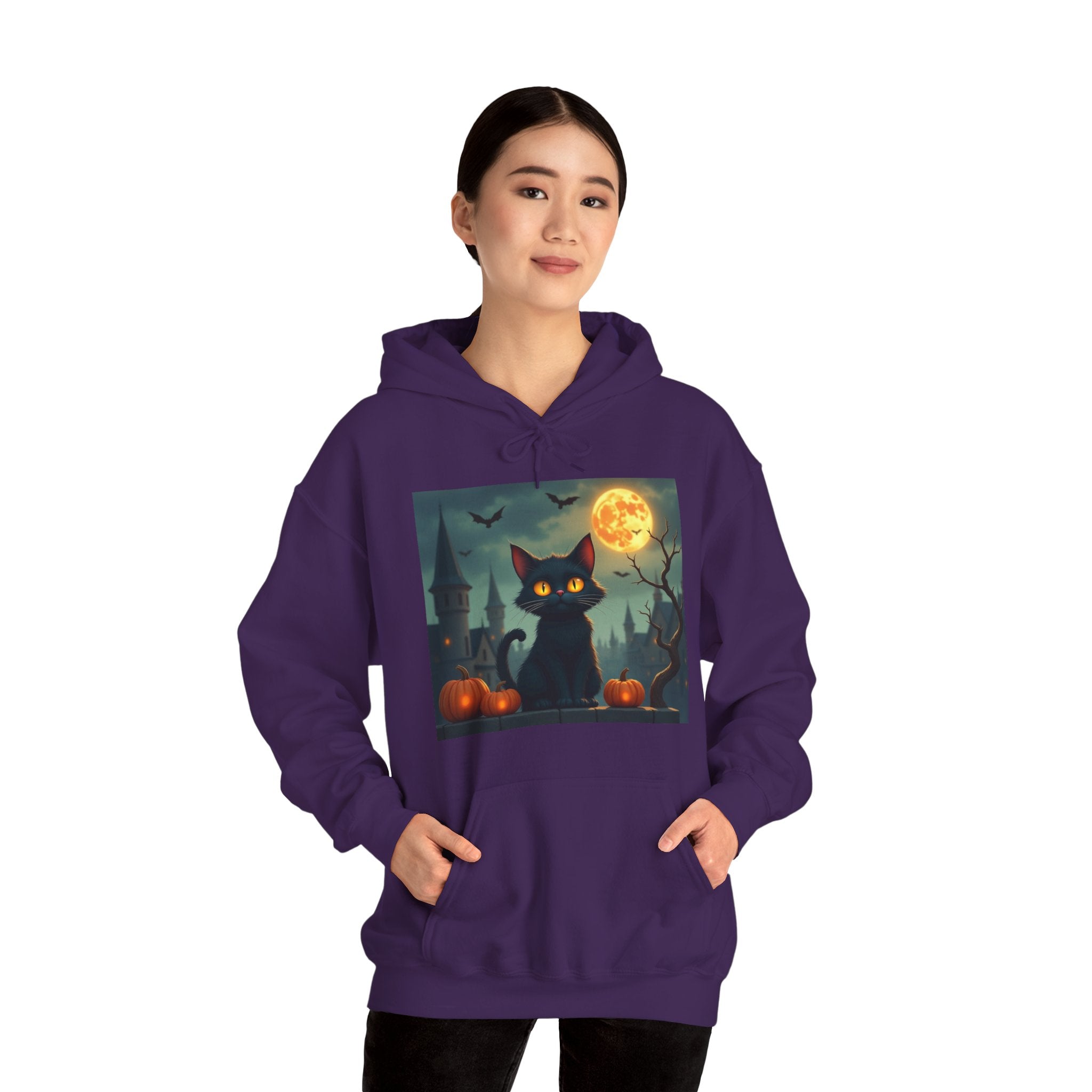 Person wearing a purple hoodie with a Halloween-themed design featuring a black cat, pumpkins, and a full moon.