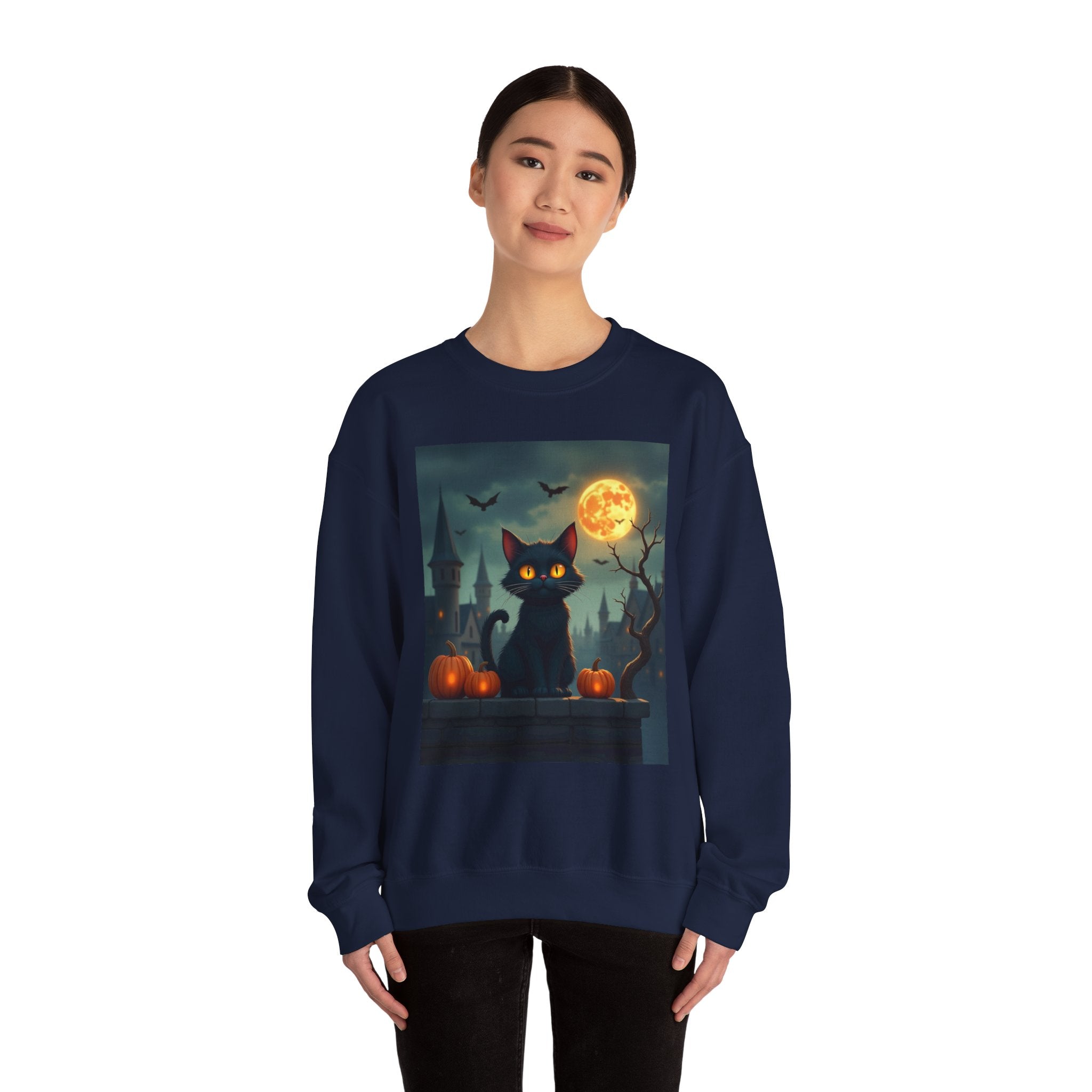 Person wearing a navy blue sweatshirt with a Halloween-themed design featuring a black cat, full moon, and pumpkins.