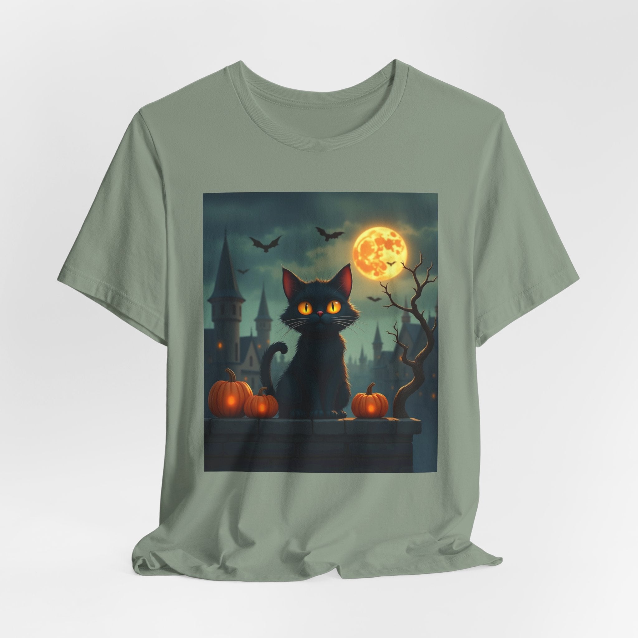 Sage green t-shirt with a Halloween-themed graphic of a black cat, pumpkins, and a full moon.