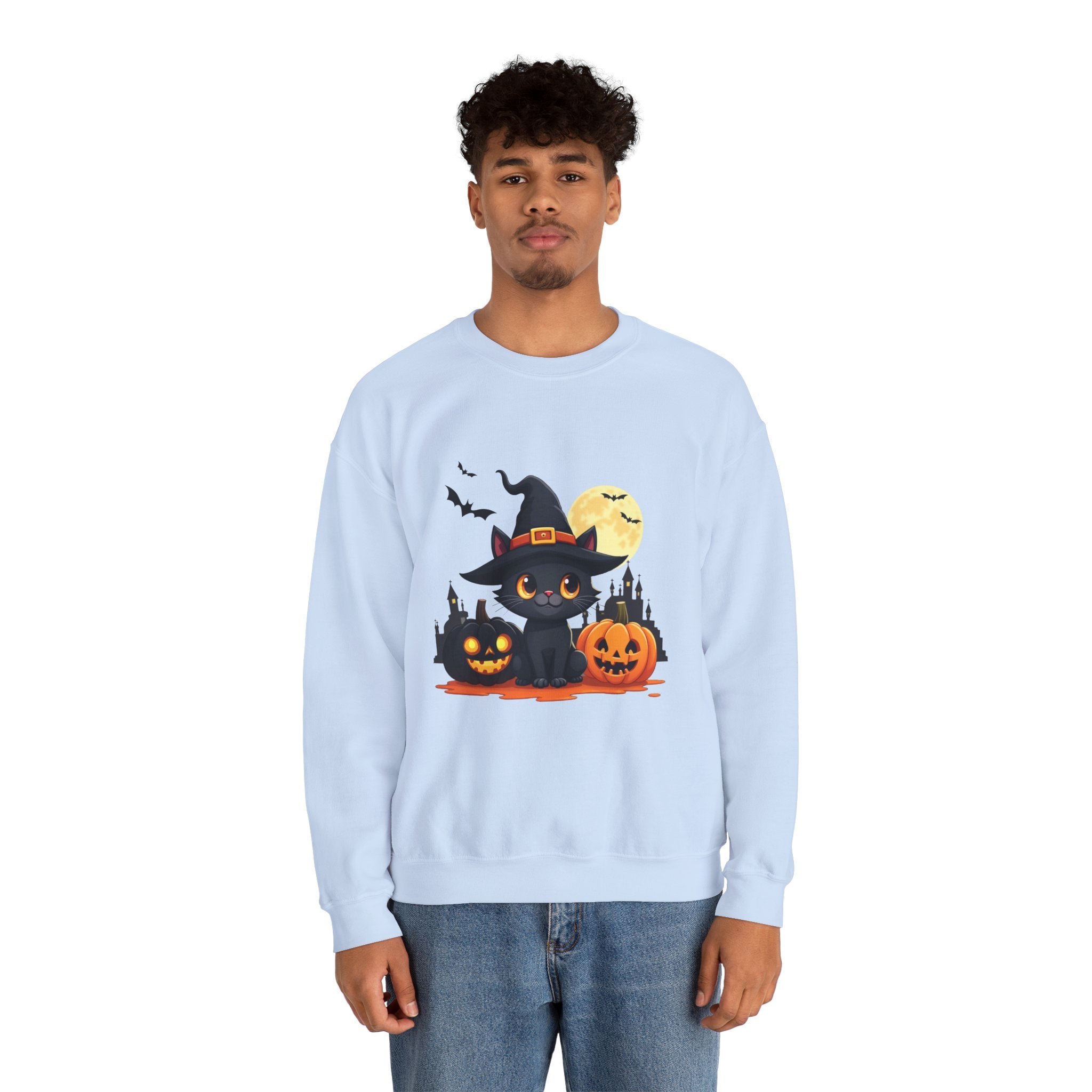 Person wearing a light blue sweatshirt with a Halloween design featuring a black cat, pumpkins, and a full moon.