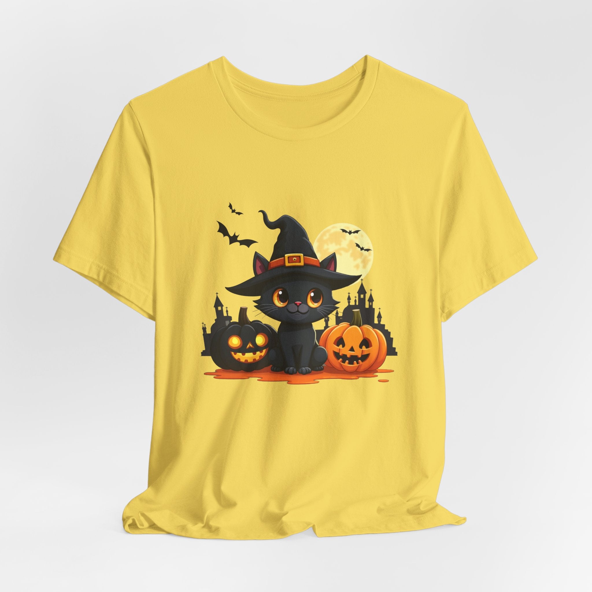 Maze yellow t-shirt with Halloween-themed design featuring a black cat in a witch hat and pumpkins on a white background.