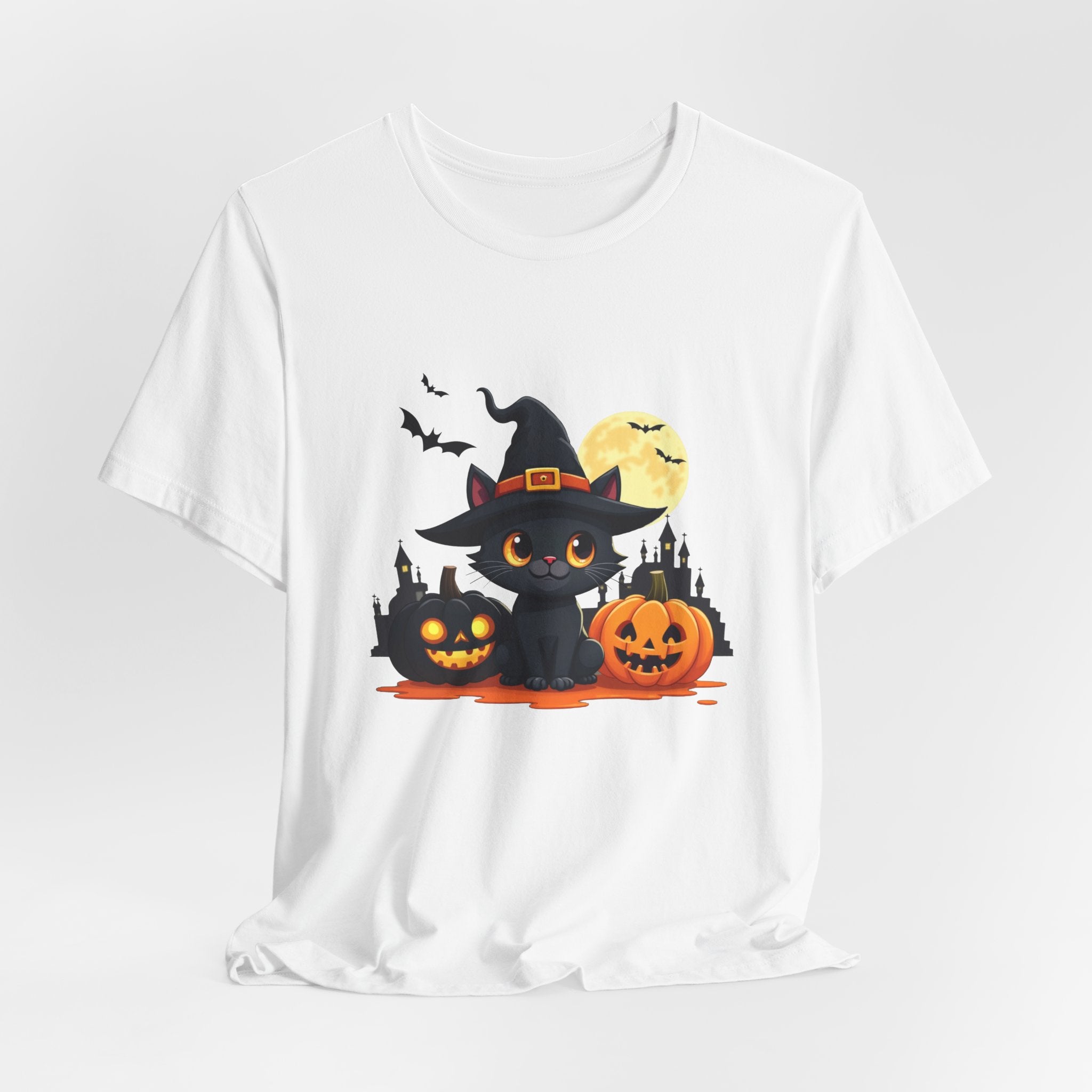 White t-shirt with Halloween-themed design featuring a cat in a witch hat, pumpkins, and bats on a white background.
