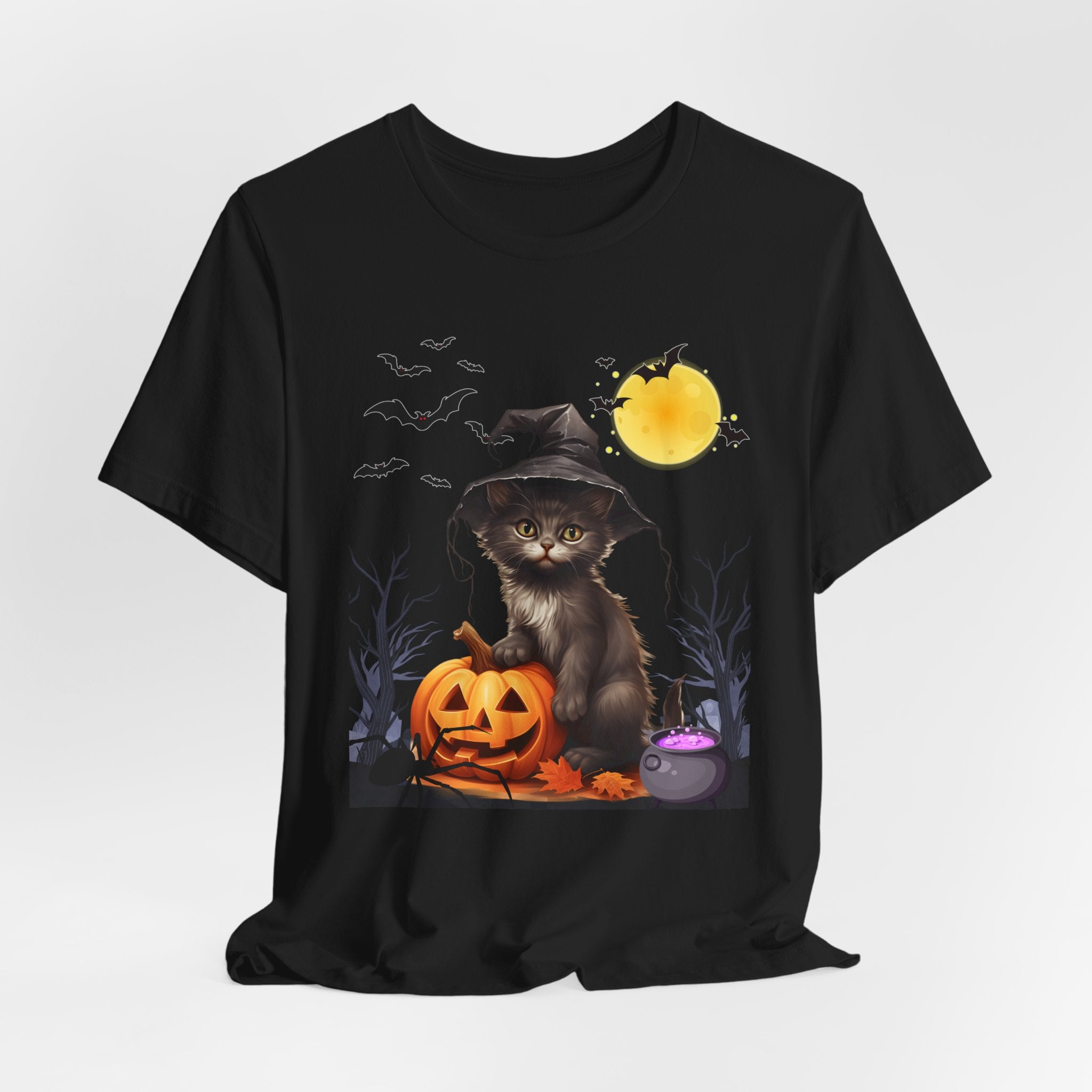 Black t-shirt with a Halloween-themed design featuring a cat in a witch hat and pumpkin.