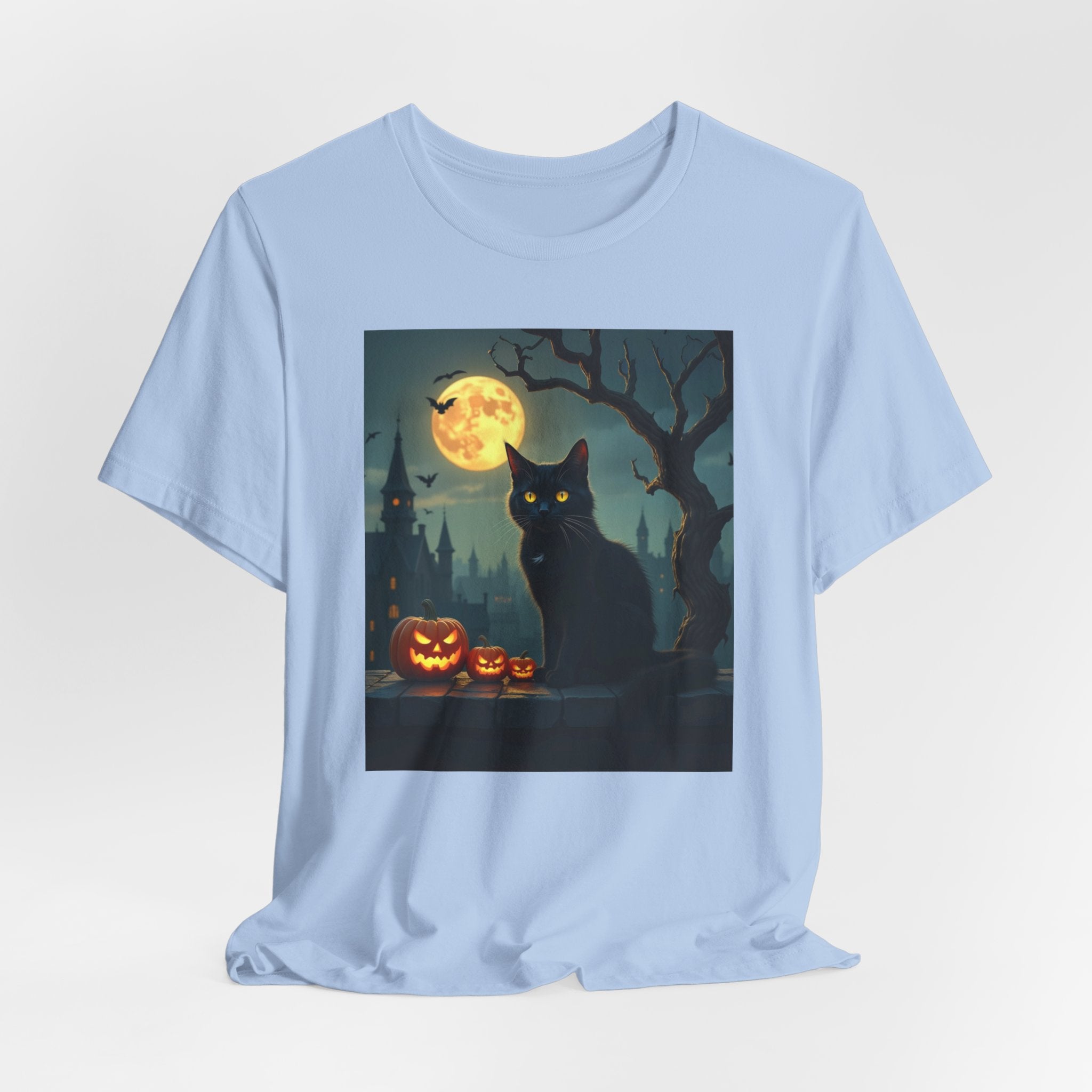 Light blue t-shirt with a Halloween-themed graphic of a black cat, full moon, and pumpkins on a white background.