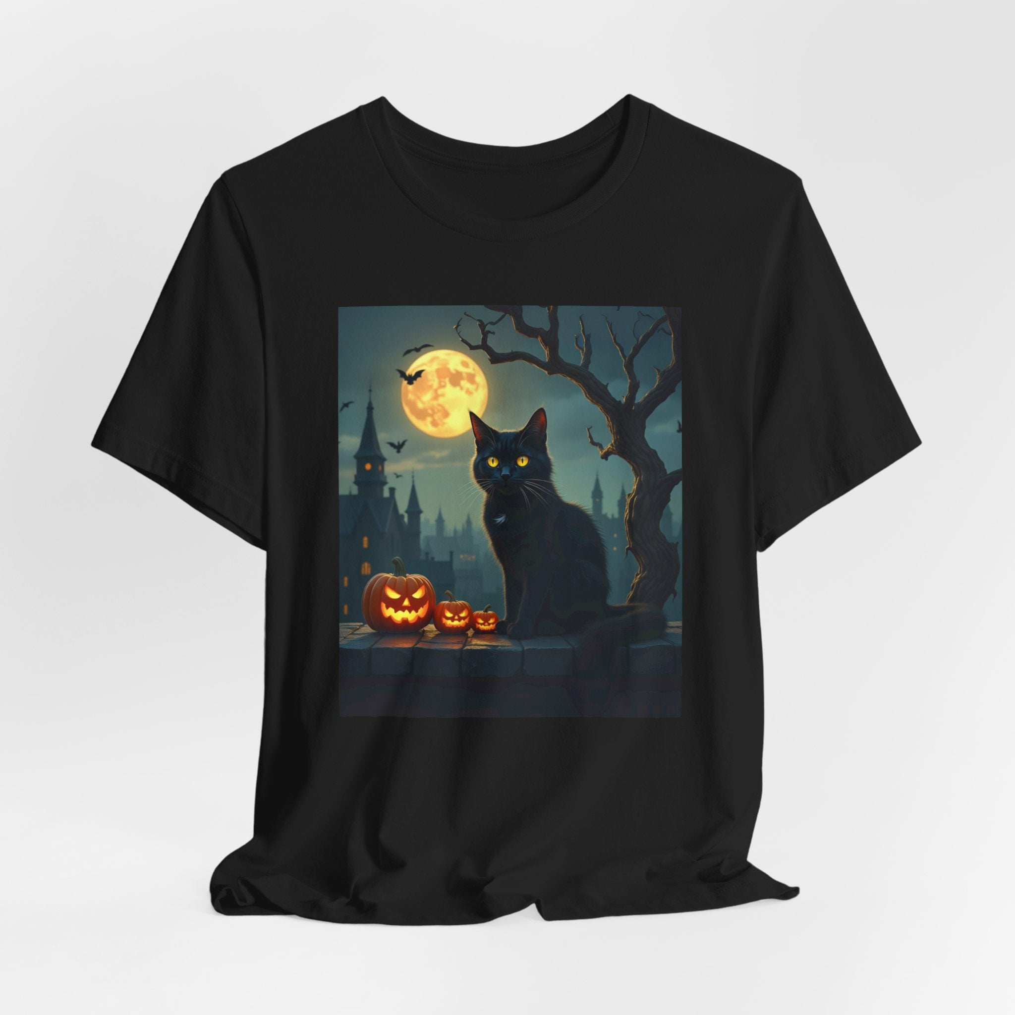 Black t-shirt with a Halloween design featuring a black cat, pumpkins, and a full moon.