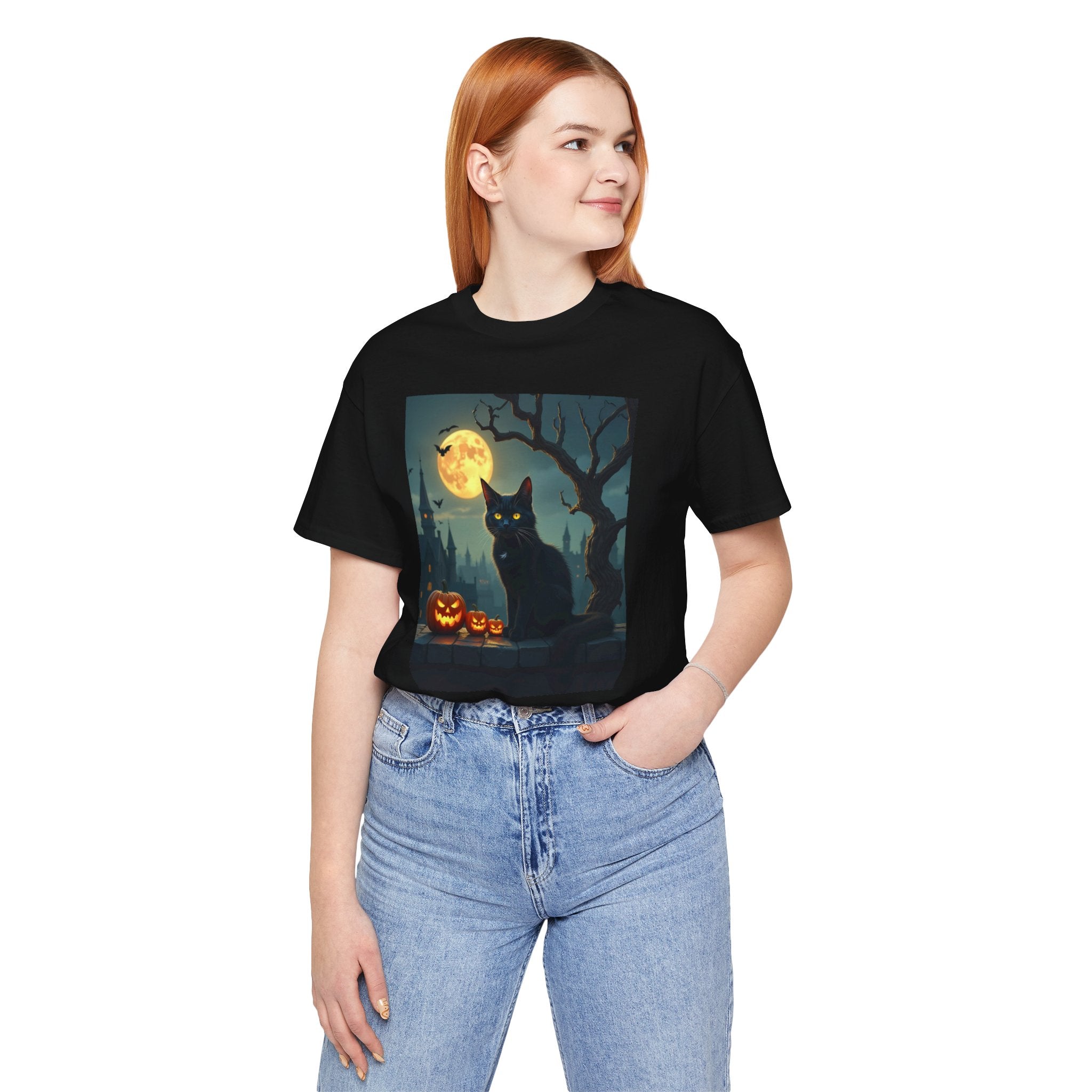 Person wearing a black t-shirt with a Halloween-themed graphic design.