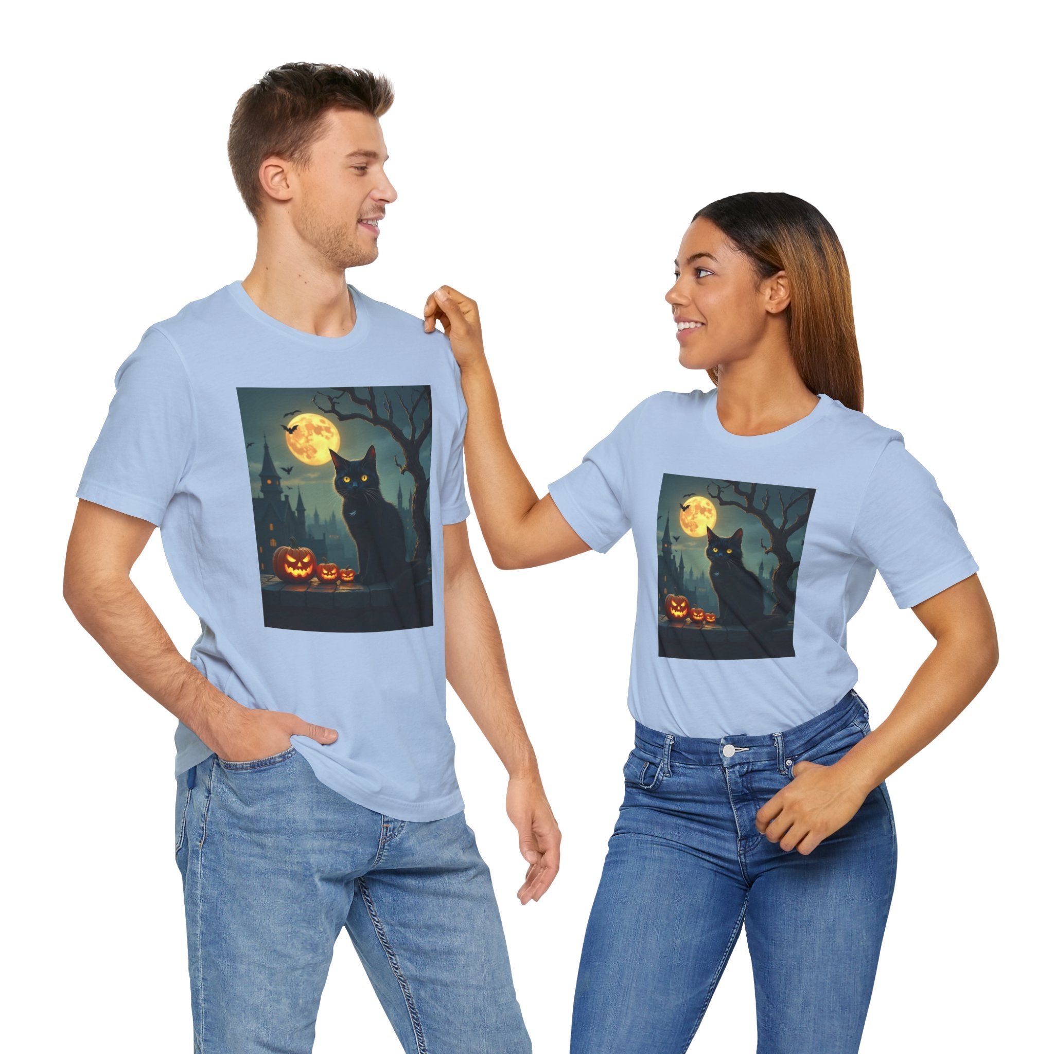 Two people wearing light blue t-shirts with a black cat and pumpkin design on a white background