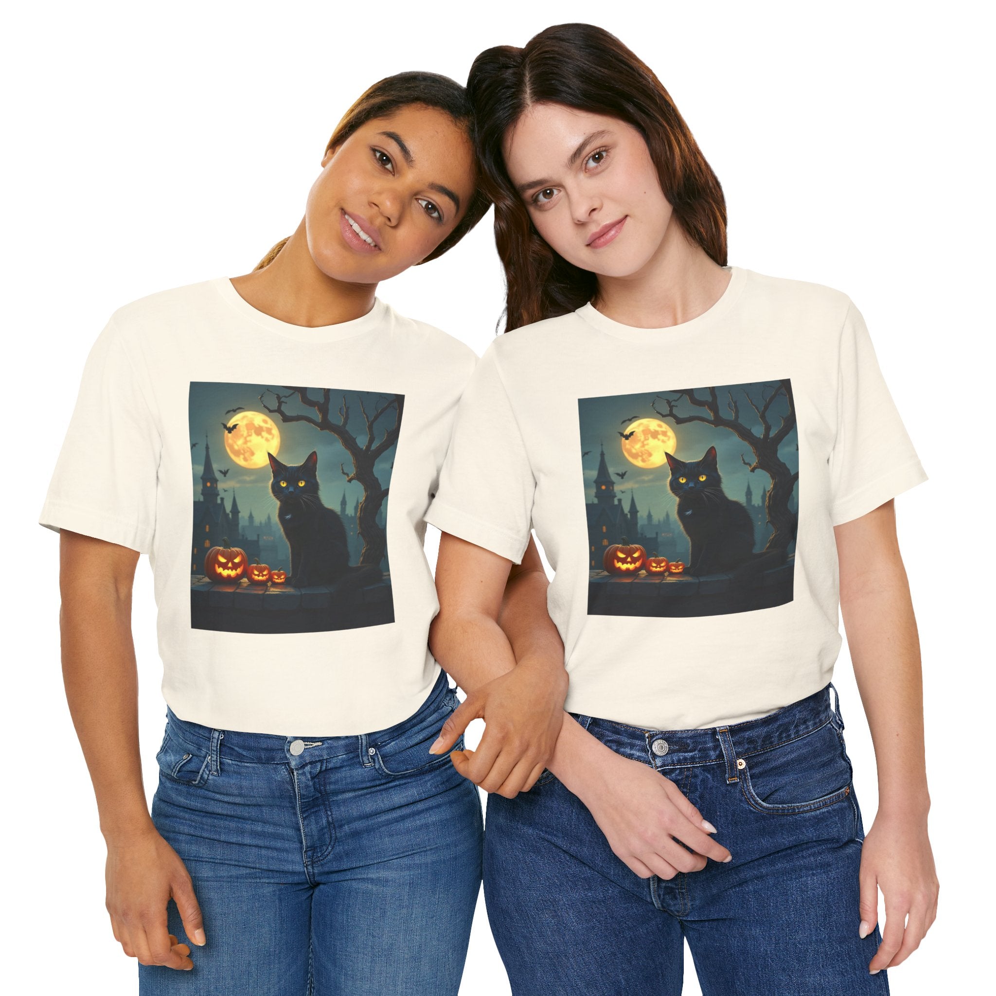 Two people wearing t-shirts with a Halloween design featuring a black cat, pumpkins, and a full moon.