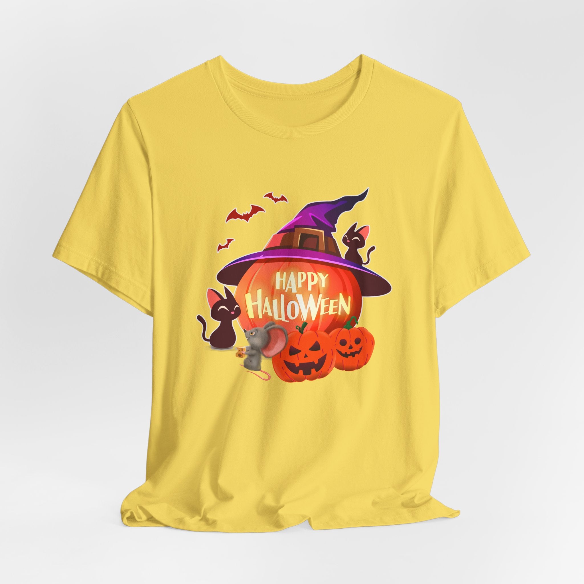 Maze yellow t-shirt with Halloween-themed design featuring pumpkins, bats, rodents, and a witch hat on a light gray edge background.